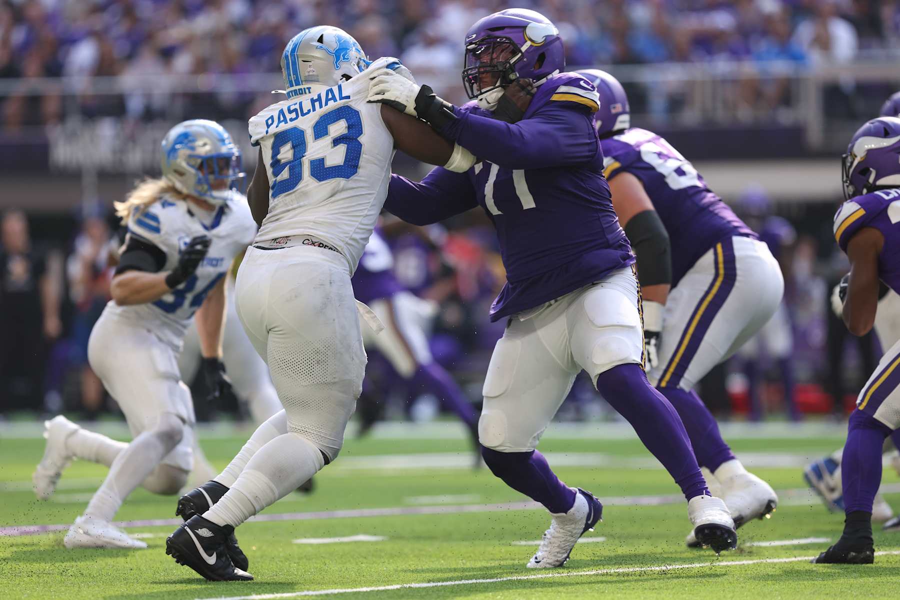 MINNEAPOLIS, MN - OCTOBER 20: Minnesota Vikings offensive tackle Christian Darrisaw (71) blocks Detroit Lions defensive end Josh Paschal (93) during the NFL game between the Detroit Lions and the Minnesota Vikings on October 20, 2024, at U.S. Bank Stadium in Minneapolis, MN. (Photo by Bailey Hillesheim/Icon Sportswire via Getty Images)