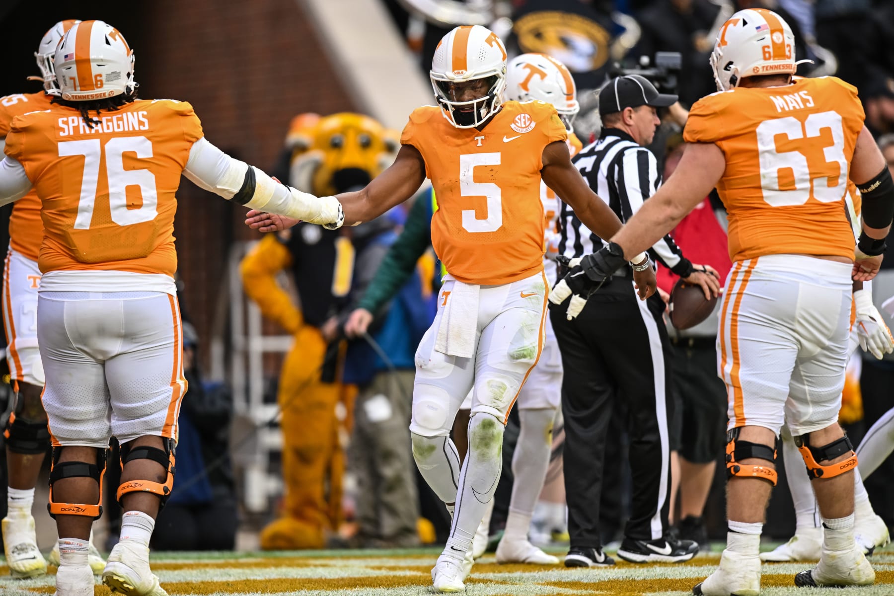 KNOXVILLE, TN - NOVEMBER 12: Tennessee Volunteers quarterback Hendon Hooker (5) celebrates with Tennessee Volunteers offensive lineman Javontez Spraggins (76) and Tennessee Volunteers offensive lineman Cooper Mays (63) during the college football game between the Tennessee Volunteers and the Missouri Tigers on November 12, 2022, at Neyland Stadium, in Knoxville, TN. (Photo by Bryan Lynn/Icon Sportswire via Getty Images)