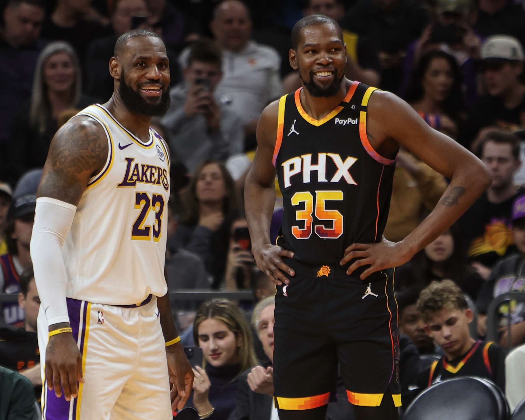 PHOENIX, AZ - NOVEMBER 26: LeBron James #23 of the Los Angeles Lakers and Kevin Durant #35 of the Phoenix Suns look on during the game on November 26, 2024 at Footprint Center in Phoenix, Arizona. NOTE TO USER: User expressly acknowledges and agrees that, by downloading and or using this photograph, user is consenting to the terms and conditions of the Getty Images License Agreement. Mandatory Copyright Notice: Copyright 2024 NBAE (Photo by Jim Poorten/NBAE via Getty Images)
