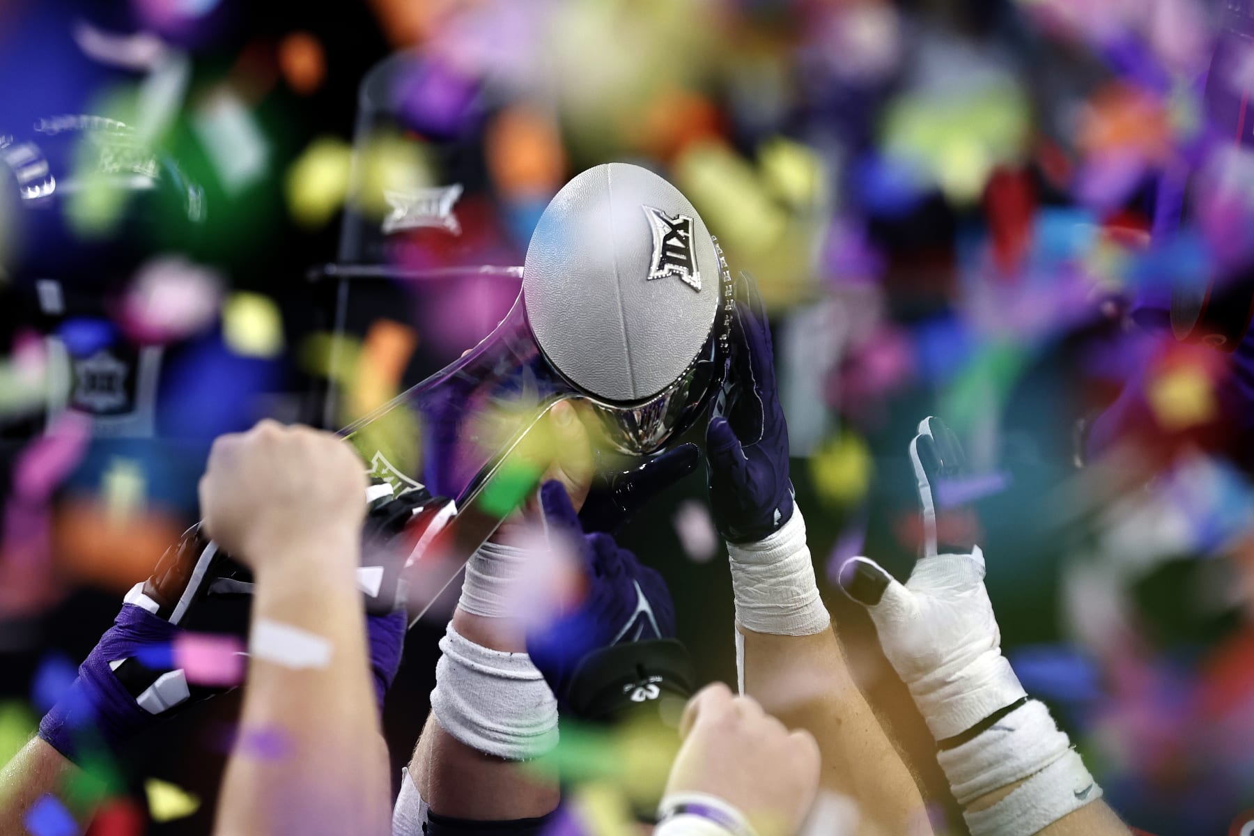ARLINGTON, TEXAS - DECEMBER 03: Kansas State Wildcats players hold up the championship trophy after the game against the TCU Horned Frogs at AT&T Stadium on December 03, 2022 in Arlington, Texas. (Photo by Tim Heitman/Getty Images)