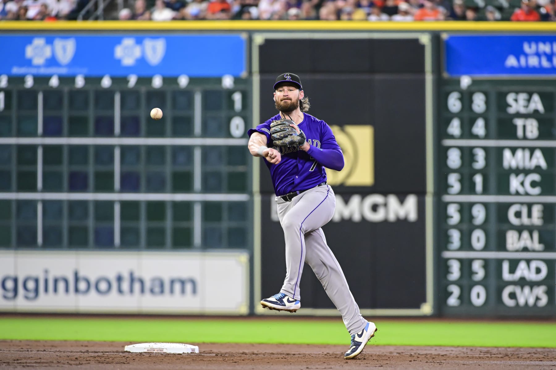 HOUSTON, TEXAS - JUNE 26: Brendan Rodgers #7 of the Colorado Rockies fields a ball against the Houston Astros at Minute Maid Park on June 26, 2024 in Houston, Texas. (Photo by Logan Riely/Getty Images)