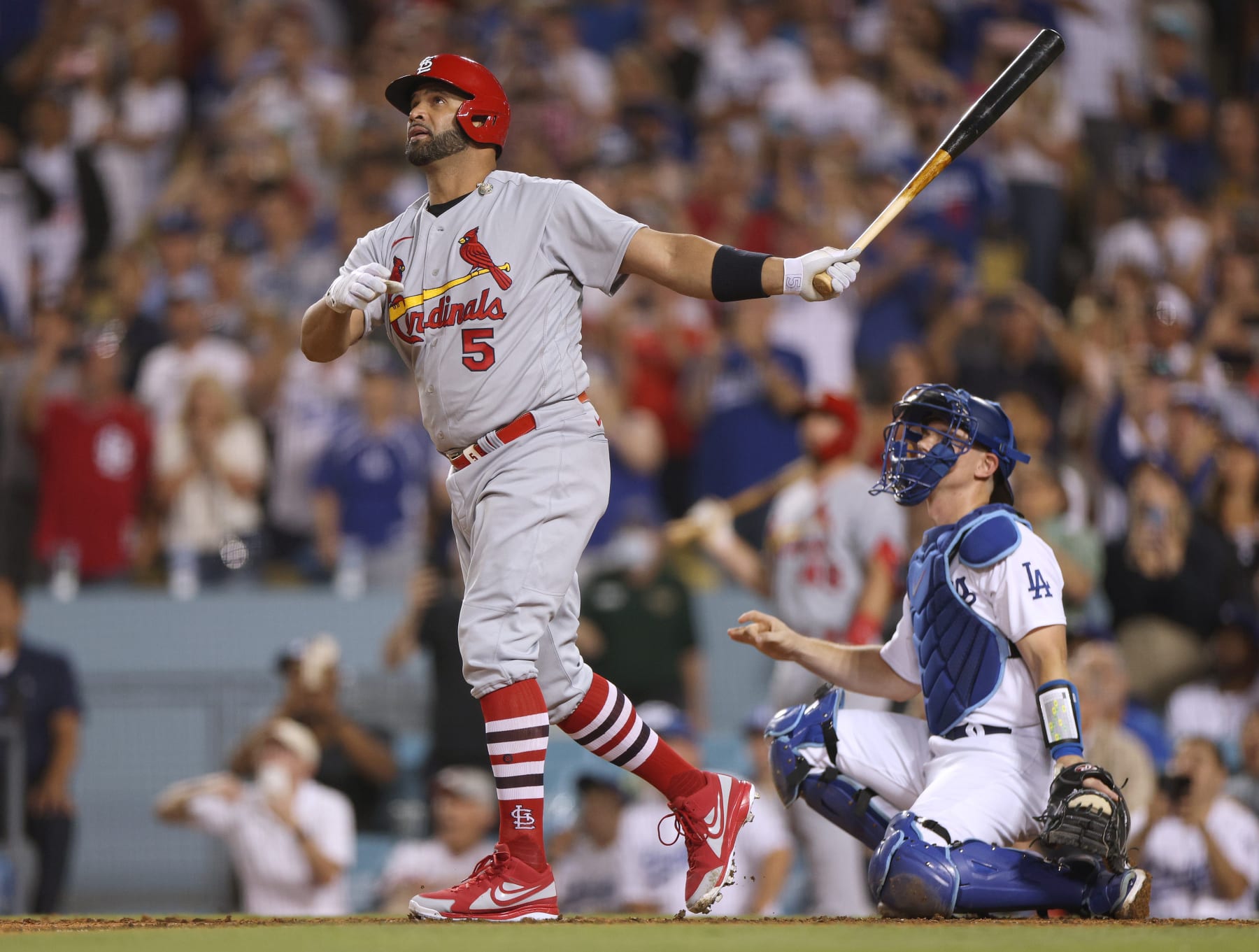 LOS ANGELES, CALIFORNIA - SEPTEMBER 23:  Albert Pujols #5 of the St. Louis Cardinals watches his 700th career homerun with Will Smith #16 of the Los Angeles Dodgers, a three run homerun to take a 5-0 lead, during the fourth inning at Dodger Stadium on September 23, 2022 in Los Angeles, California. (Photo by Harry How/Getty Images)