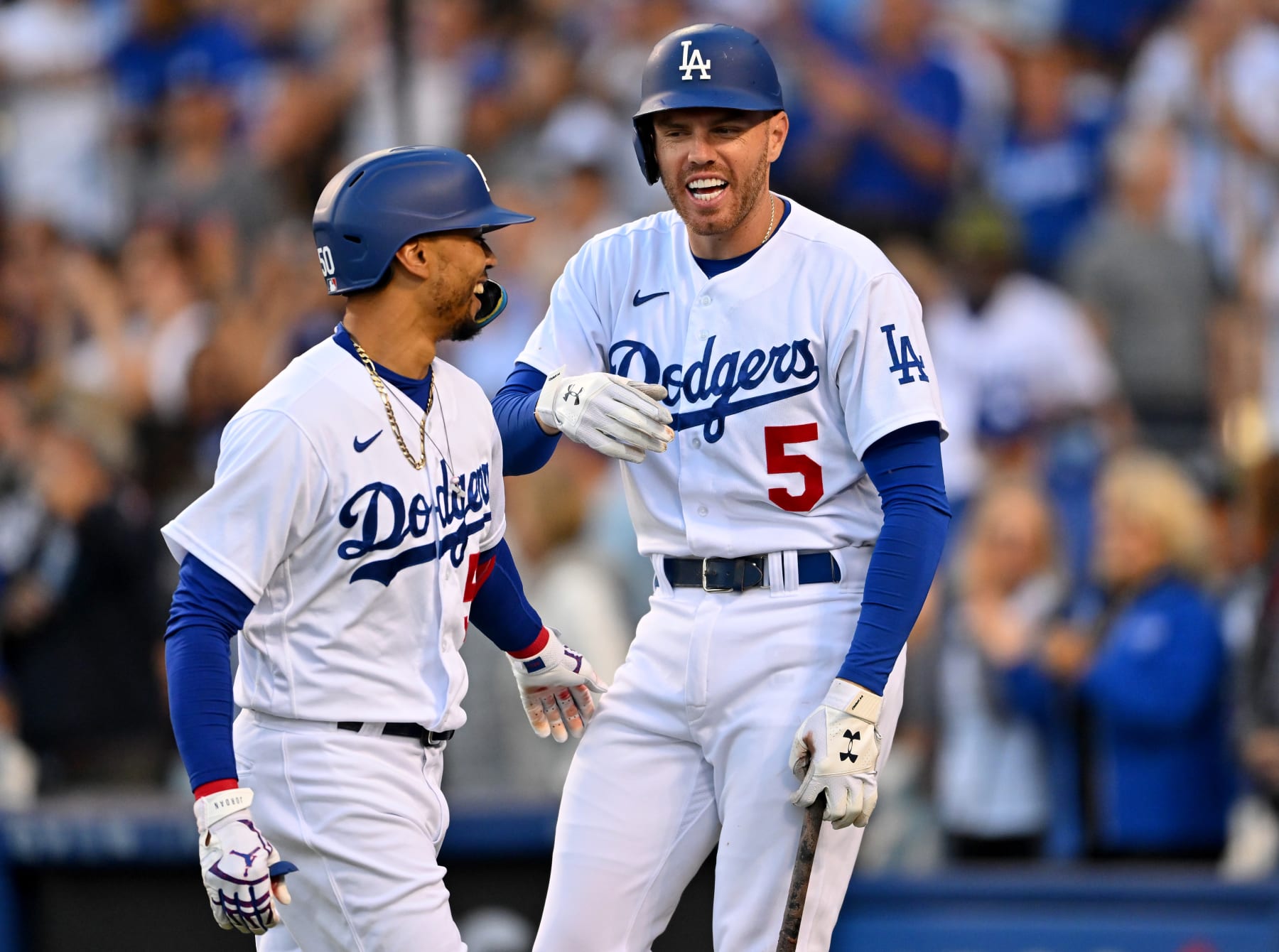 LOS ANGELES, CA - JULY 26: Mookie Betts #50 of the Los Angeles Dodgers is greeted by Freddie Freeman #5 after hitting a solo home run in the game against the Washington Nationals at Dodger Stadium on July 26, 2022 in Los Angeles, California. (Photo by Jayne Kamin-Oncea/Getty Images) Mookie Betts