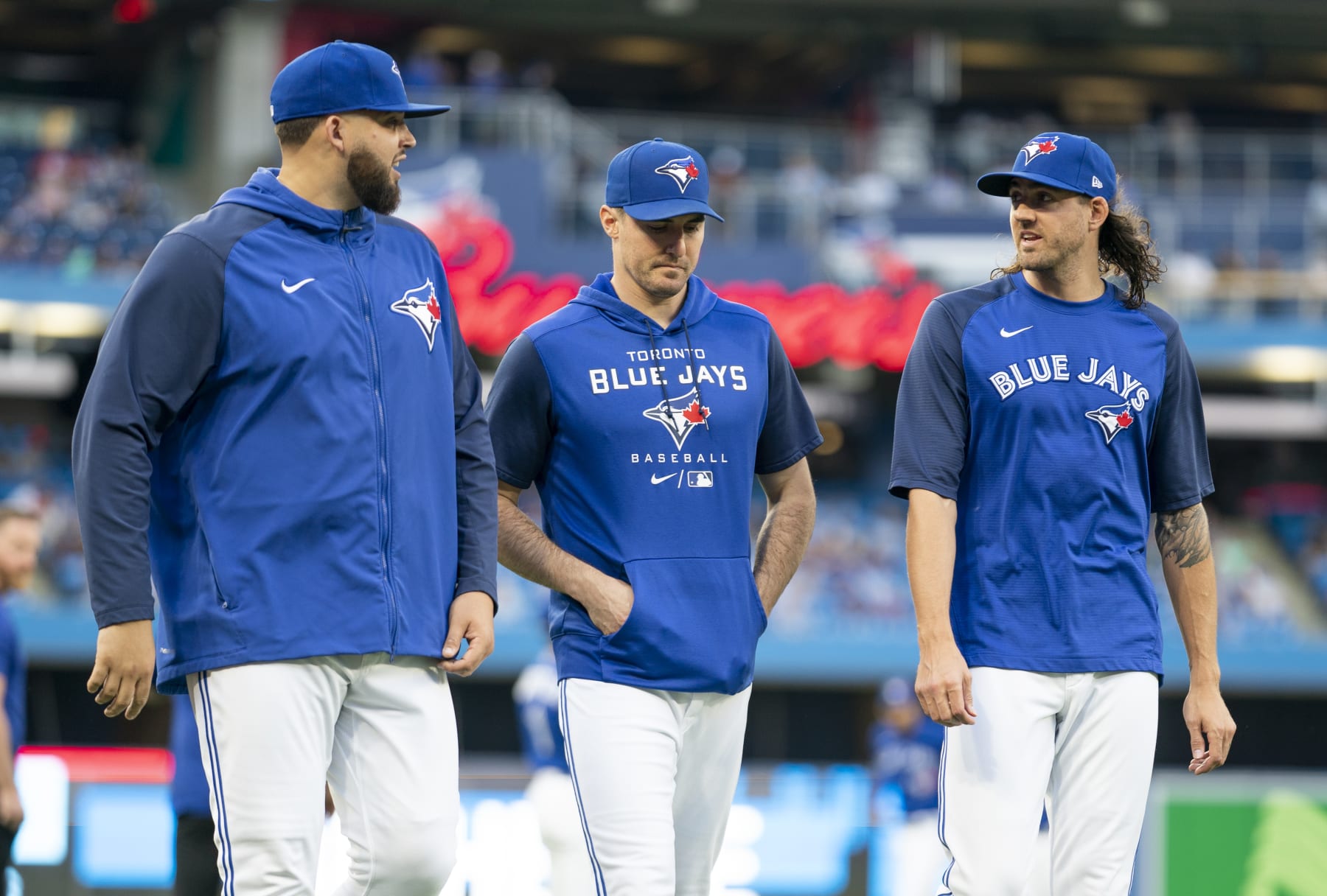 TORONTO, ON - AUGUST 31: Alek Manoah #6, Ross Stripling #48, Kevin Gausman #34 of the Toronto Blue Jays walk to the dugout before their team plays the Chicago Cubs in their MLB game at the Rogers Centre on August 31, 2022 in Toronto, Ontario, Canada. (Photo by Mark Blinch/Getty Images)