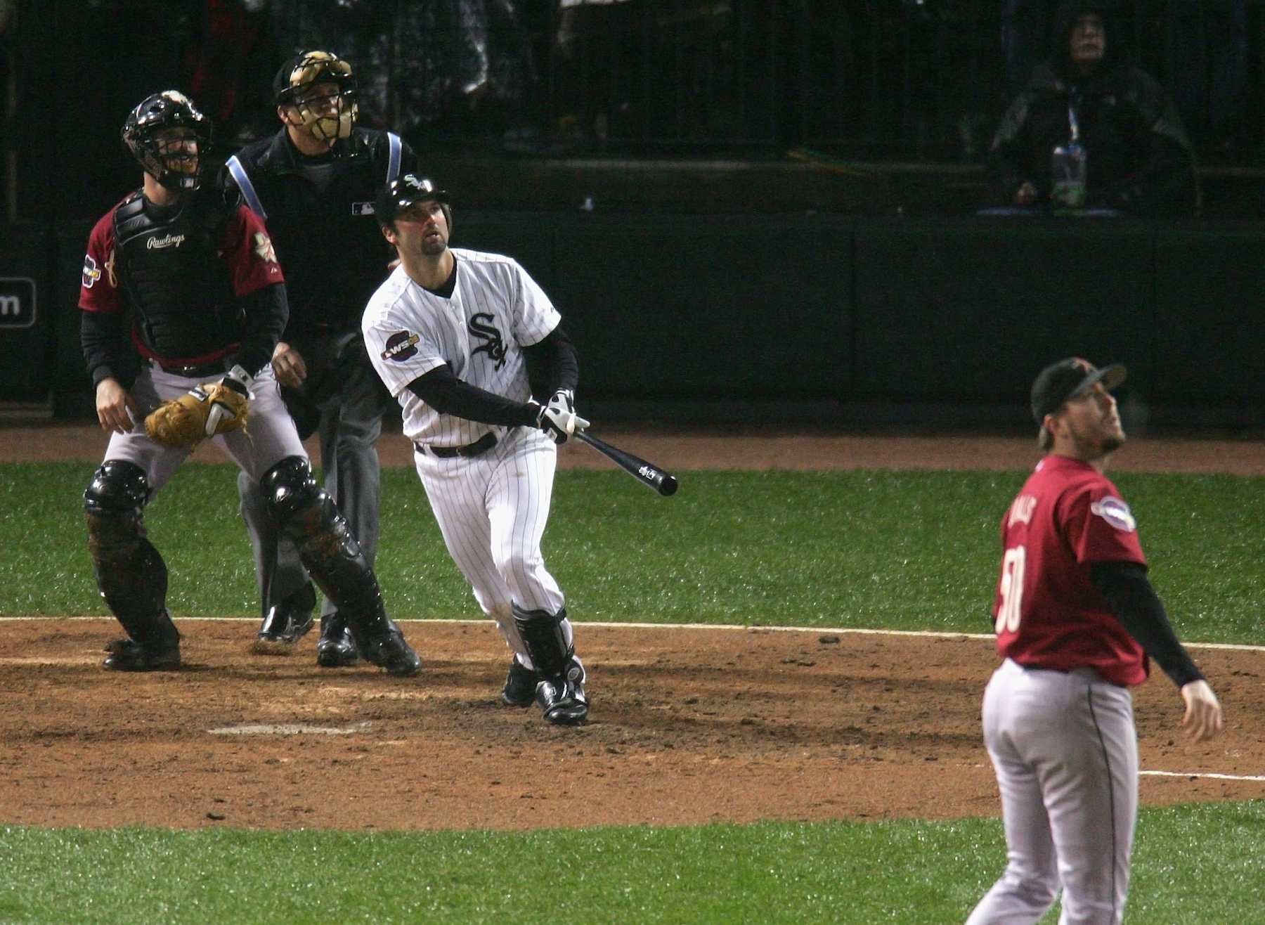 CHICAGO - OCTOBER 23:  Paul Konerko #14 of the Chicago White Sox hits a grand-slam home run against pitcher Chad Qualls #50 of the Houston Astros in the seventh inning during Game Two of the 2005 Major League Baseball World Series at U.S. Celluar Field on October 23, 2005 in Chicago, Illinois.  (Photo by Jed Jacobsohn/Getty Images)