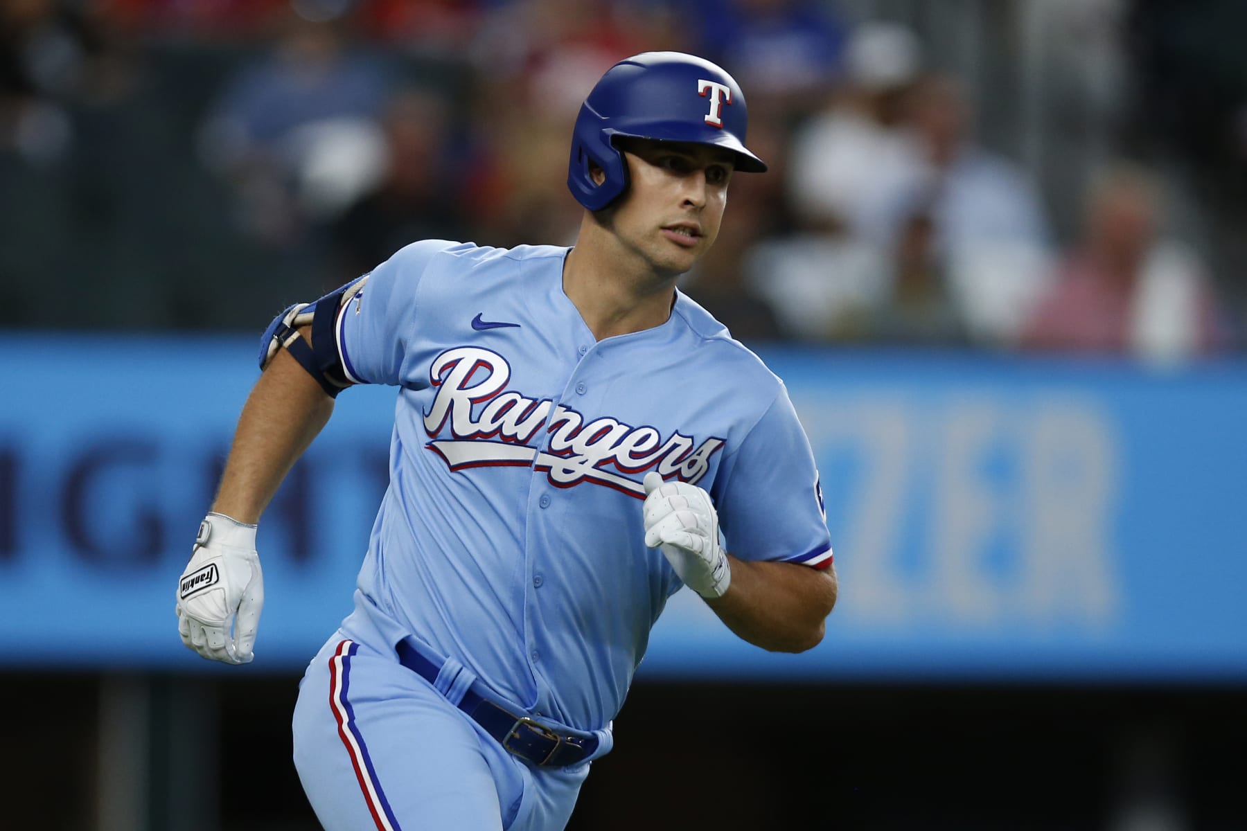 ARLINGTON, TEXAS - AUGUST 07: Nathaniel Lowe #30 of the Texas Rangers runs to first base after hitting a single in the third inning against the Chicago White Sox at Globe Life Field on August 07, 2022 in Arlington, Texas. (Photo by Tim Heitman/Getty Images)