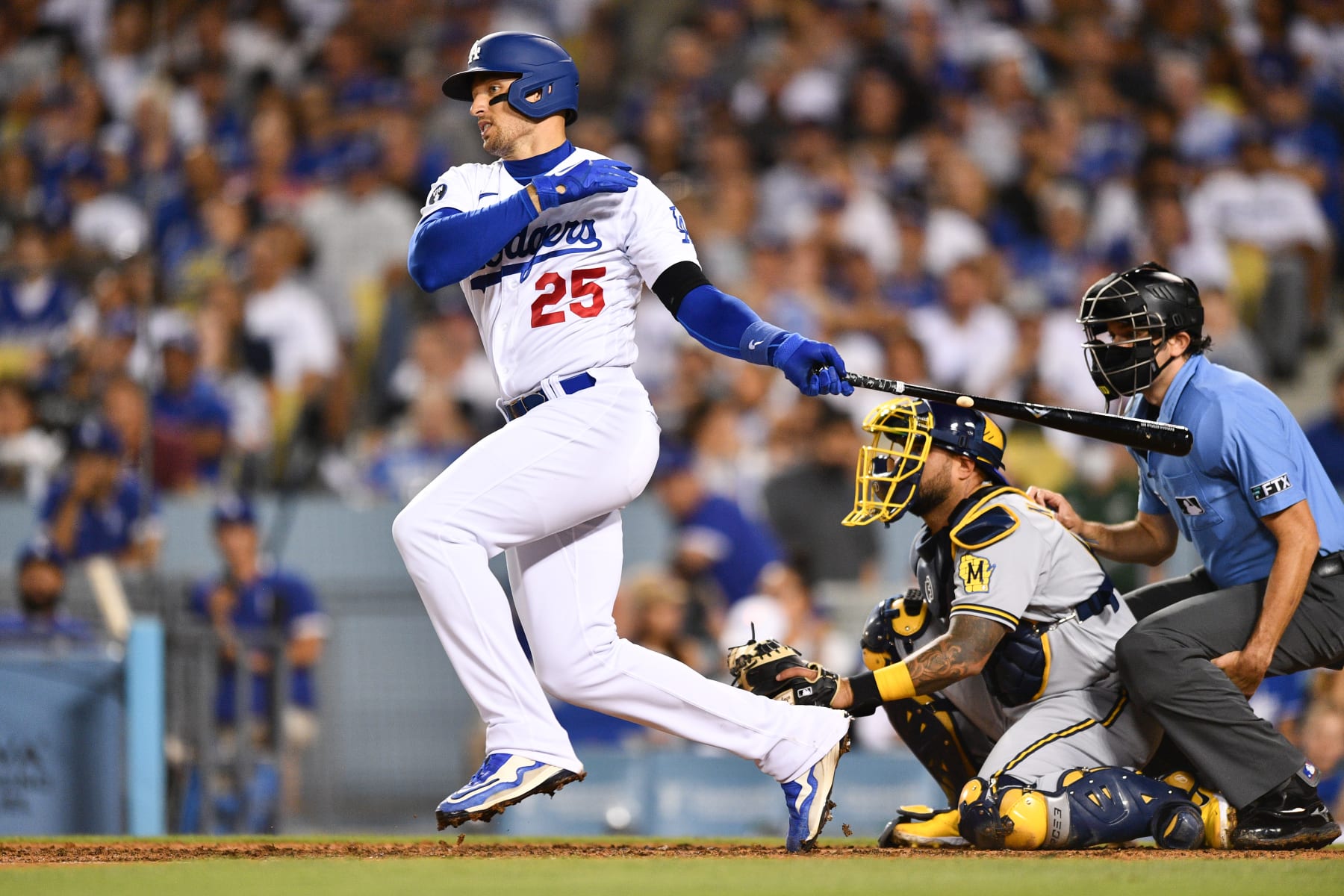LOS ANGELES, CA - AUGUST 23: Los Angeles Dodgers left fielder Trayce Thompson (25) drives in a run during the MLB game between the Milwaukee Brewers and the Los Angeles Dodgers on August 23, 2022 at Dodger Stadium in Los Angeles, CA. (Photo by Brian Rothmuller/Icon Sportswire via Getty Images)
