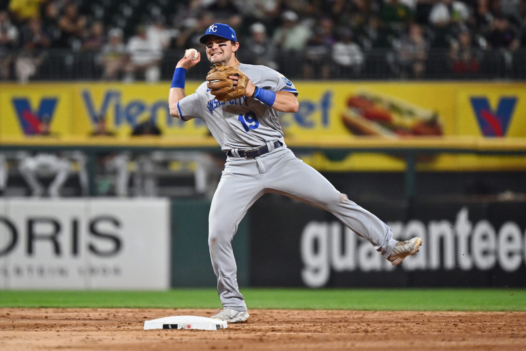 CHICAGO, IL - AUGUST 31:  Michael Massey #19 of the Kansas City Royals throws to first base against the Chicago White Sox at Guaranteed Rate Field on August 31, 2022 in Chicago, Illinois.  (Photo by Jamie Sabau/Getty Images)