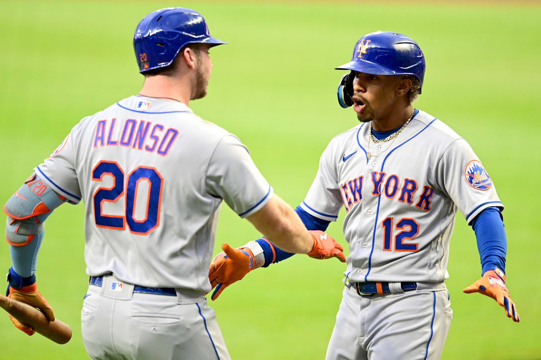 ATLANTA, GA - AUGUST 17: Francisco Lindor #12 of the New York Mets celebrates with Pete Alonso #20 of the New York Mets after hitting a home run during the first inning against the Atlanta Braves at Truist Park on August 17, 2022 in Atlanta, Georgia. (Photo by Adam Hagy/Getty Images)
