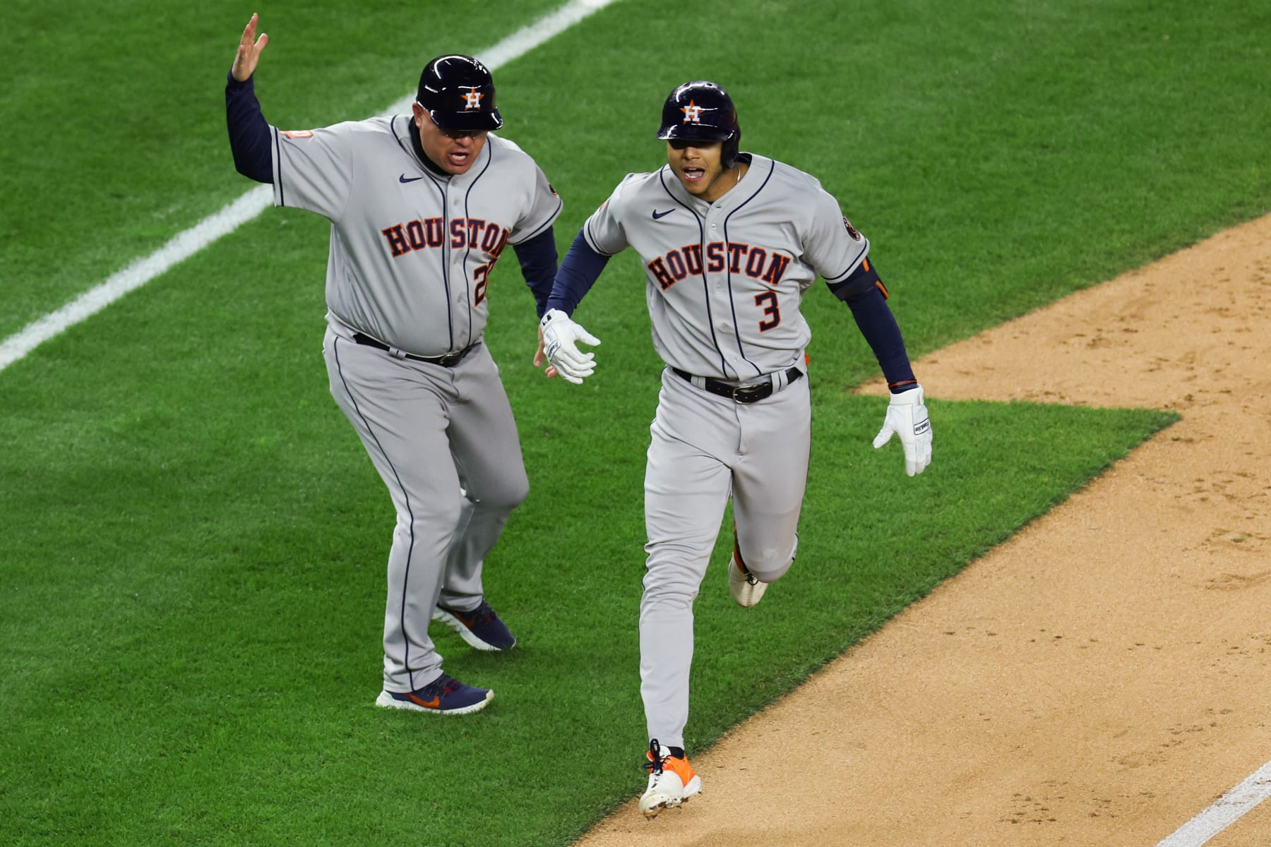 NEW YORK, NEW YORK - OCTOBER 23: Jeremy Pena #3 of the Houston Astros celebrates his three-run home run with first base coach Omar Lopez #22 in the third inning against the New York Yankees in game four of the American League Championship Series at Yankee Stadium on October 23, 2022 in the Bronx borough of New York City. (Photo by Jamie Squire/Getty Images)
