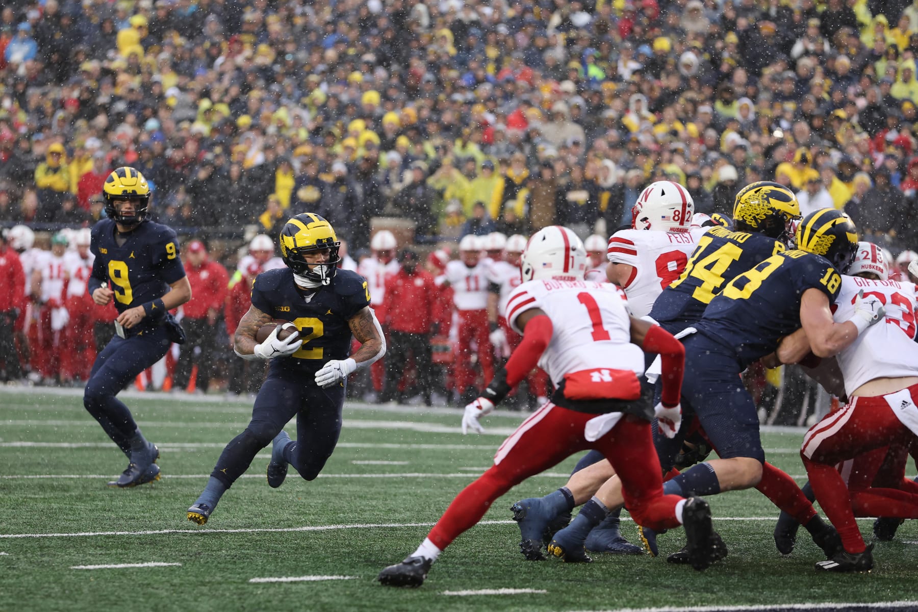 ANN ARBOR, MICHIGAN - NOVEMBER 12: Blake Corum #2 of the Michigan Wolverines runs for a first half touchdown behind Tyreke Johnson #1 of the Nebraska Cornhuskers at Michigan Stadium on November 12, 2022 in Ann Arbor, Michigan. (Photo by Gregory Shamus/Getty Images)