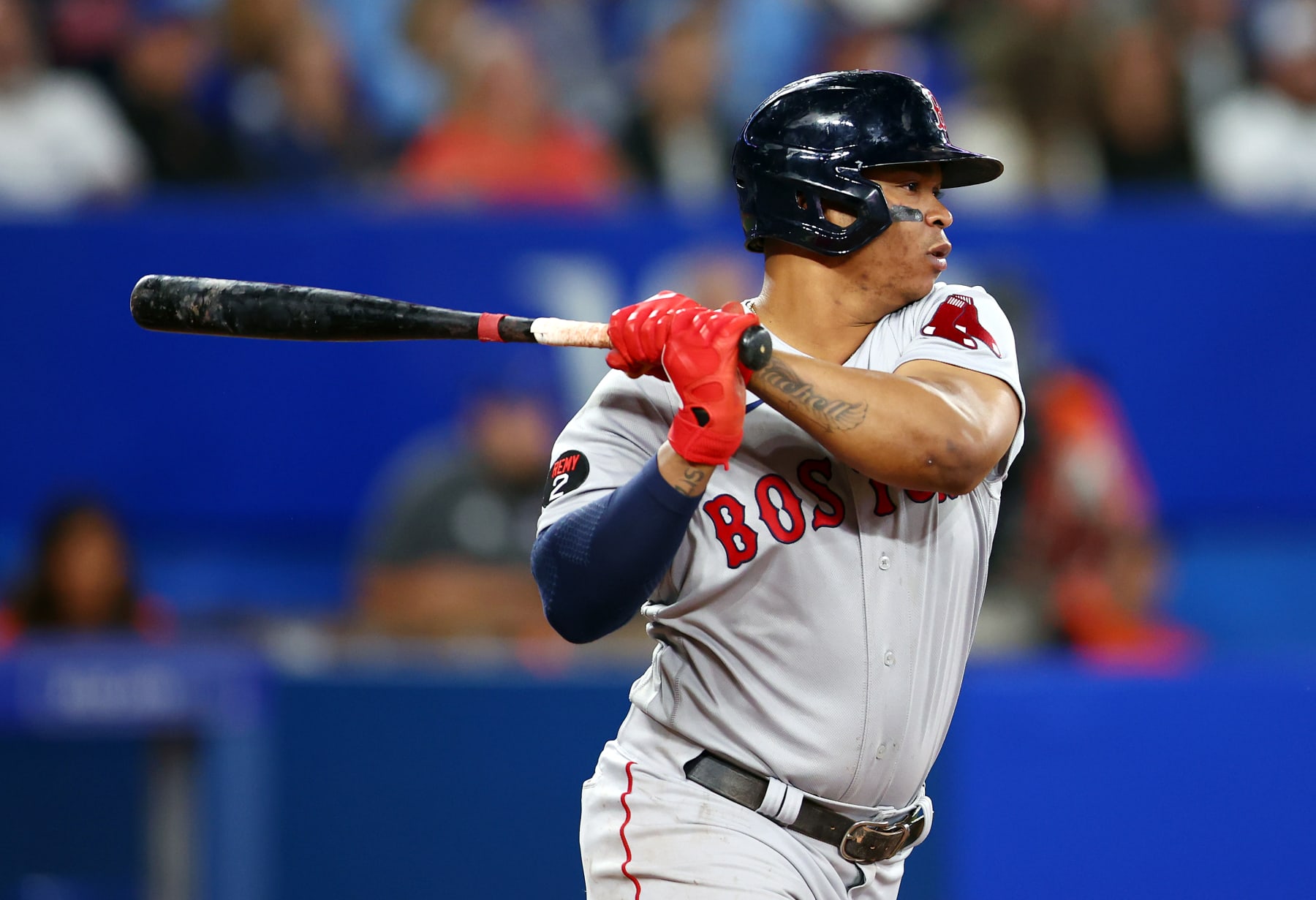 TORONTO, ON - SEPTEMBER 30:  Rafael Devers #11 of the Boston Red Sox bats against the Toronto Blue Jays at Rogers Centre on September 30, 2022 in Toronto, Ontario, Canada.  (Photo by Vaughn Ridley/Getty Images)