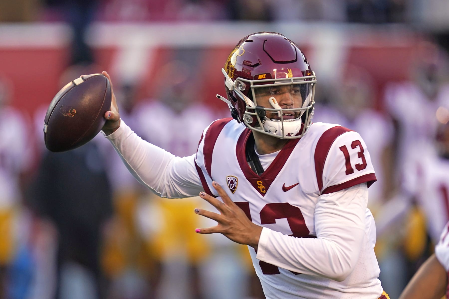 Southern California quarterback Caleb Williams (13) looks for a receiver during the first half of the team's NCAA college football game against Utah on Saturday, Oct. 15, 2022, in Salt Lake City. (AP Photo/Rick Bowmer)