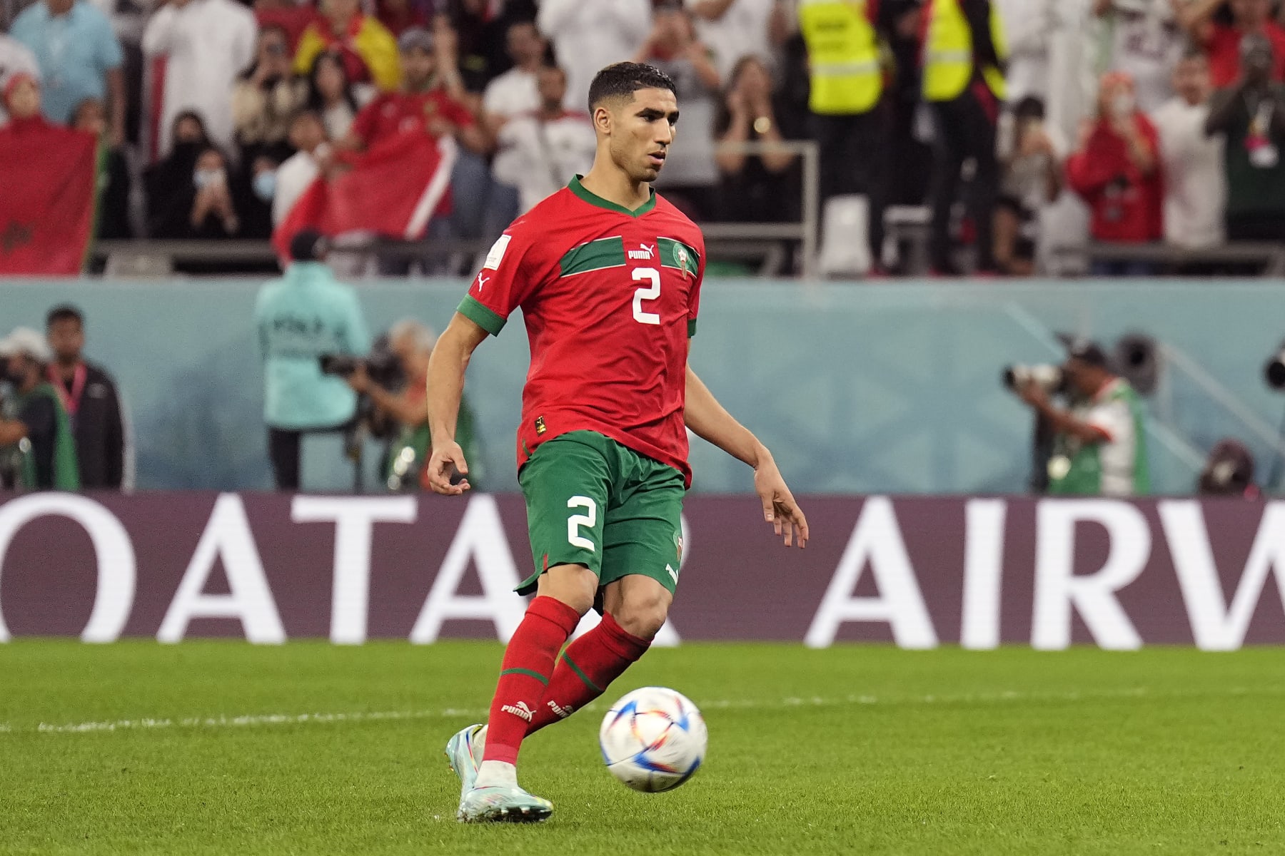 Morocco's Achraf Hakimi scores the winning penalty during a shootout after the World Cup round of 16 soccer match between Morocco and Spain, at the Education City Stadium in Al Rayyan, Qatar, Tuesday, Dec. 6, 2022. (AP Photo/Martin Meissner)