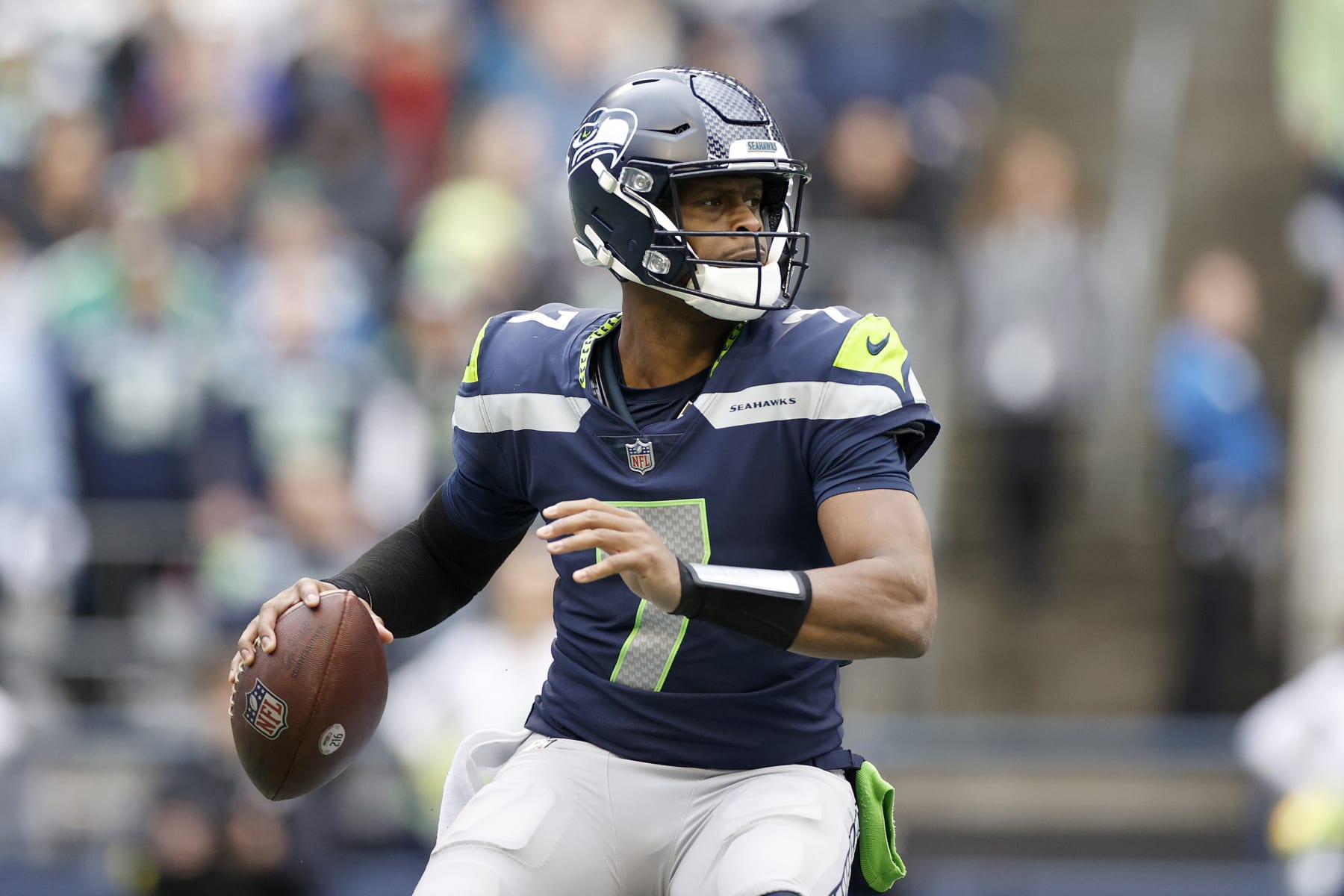 SEATTLE, WASHINGTON - JANUARY 01: Geno Smith #7 of the Seattle Seahawks looks to pass against the New York Jets during the second quarter at Lumen Field on January 01, 2023 in Seattle, Washington. (Photo by Steph Chambers/Getty Images)