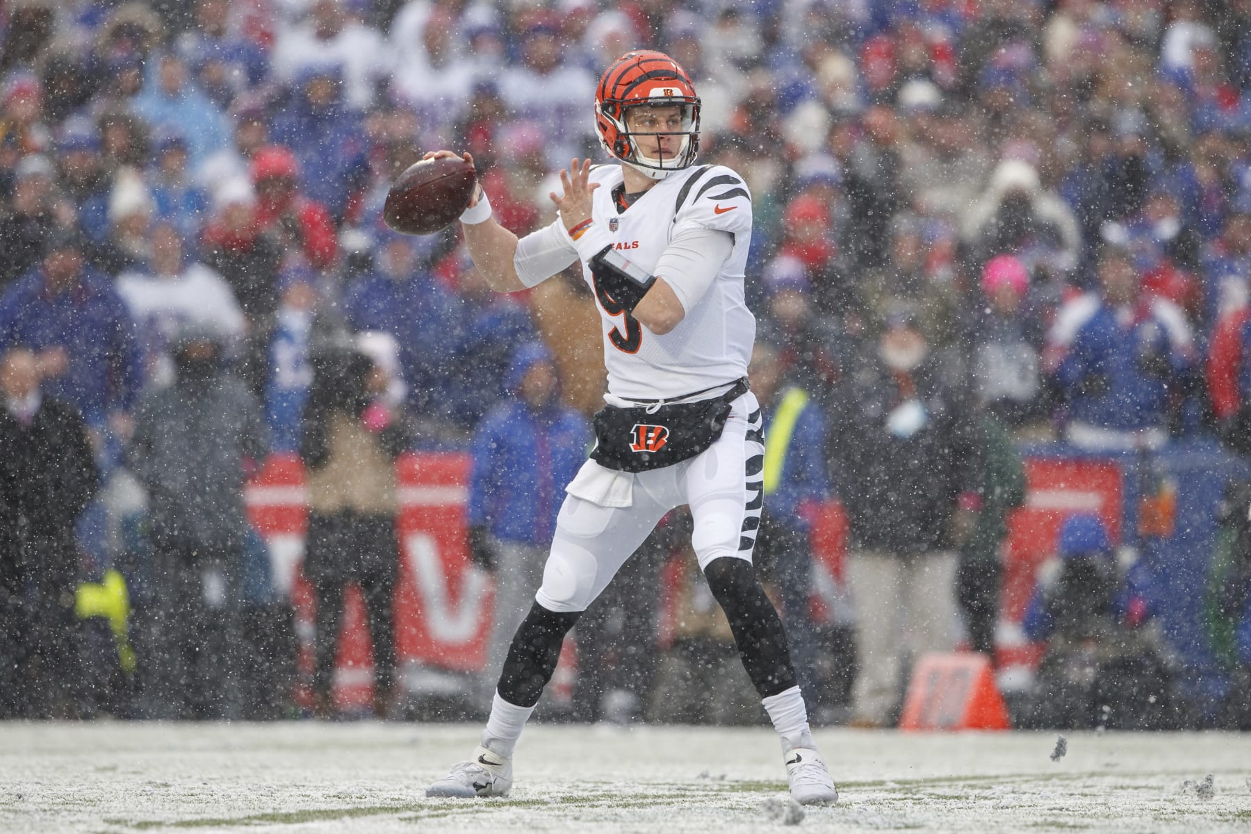 Cincinnati Bengals quarterback Joe Burrow (9) throws a pass during an NFL divisional round playoff football game Sunday, Jan. 22, 2023, in Orchard Park, NY. (AP Photo/Matt Durisko)