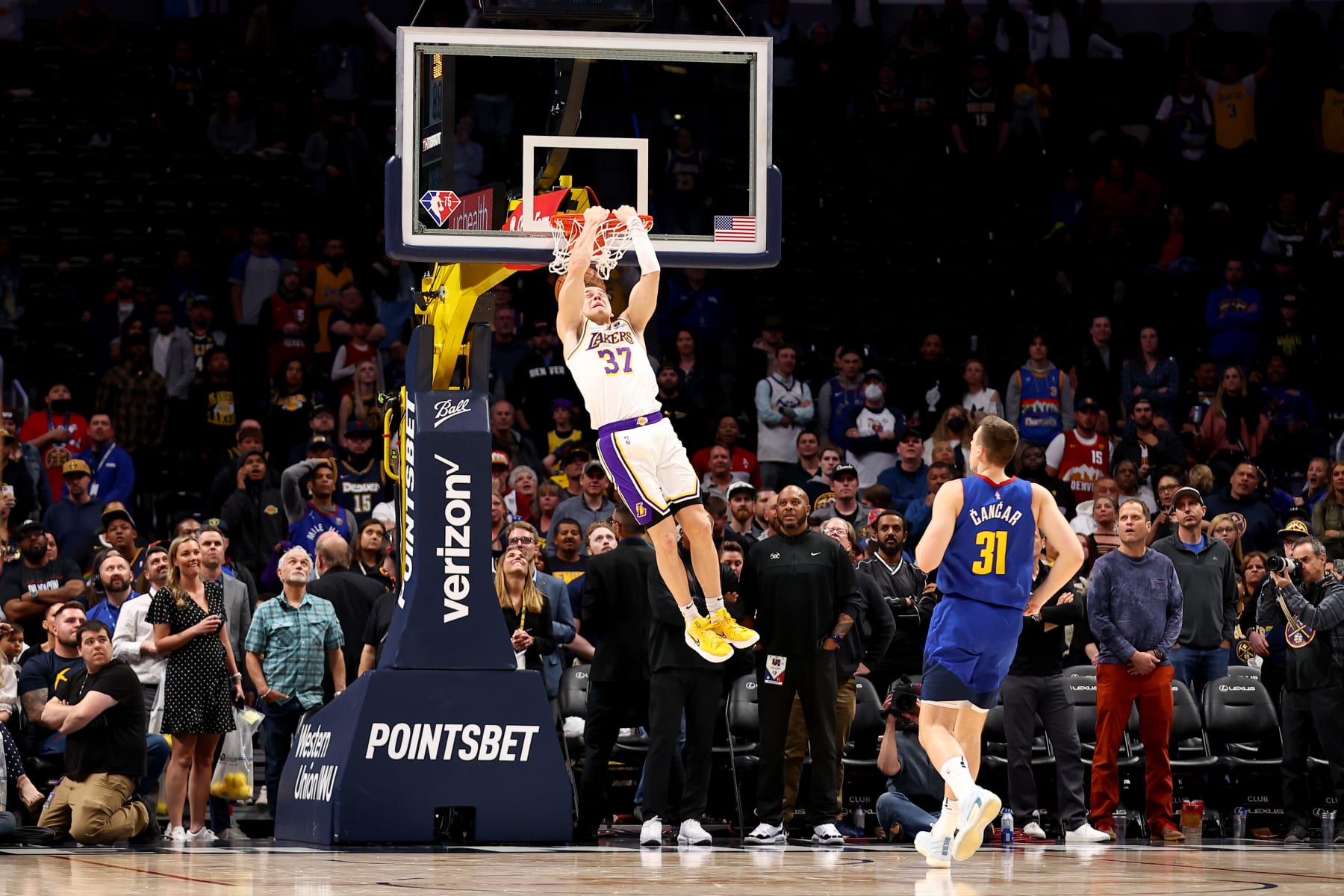 DENVER, CO - APRIL 10: Mac McClung #37 of the Los Angeles Lakers dunks to finish the game against the Denver Nuggets at Ball Arena on April 10, 2022 in Denver, Colorado. NOTE TO USER: User expressly acknowledges and agrees that, by downloading and/or using this Photograph, user is consenting to the terms and conditions of the Getty Images License Agreement. (Photo by Jamie Schwaberow/Getty Images)