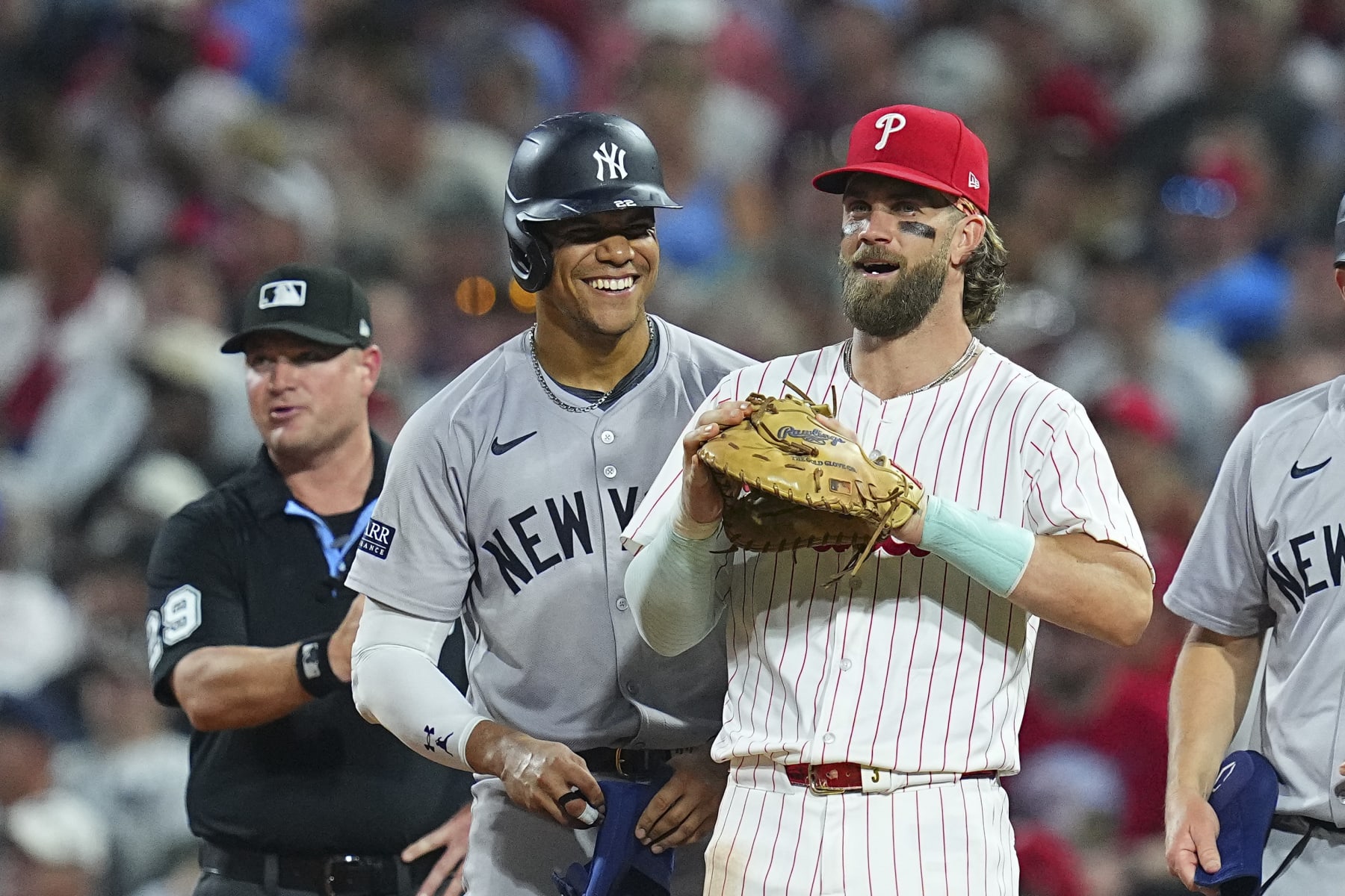 PHILADELPHIA, PENNSYLVANIA - JULY 29: Juan Soto #22 of the New York Yankees interacts with Bryce Harper #3 of the Philadelphia Phillies at Citizens Bank Park on July 29, 2024 in Philadelphia, Pennsylvania. The Yankees defeated the Phillies 14-4. (Photo by Mitchell Leff/Getty Images)