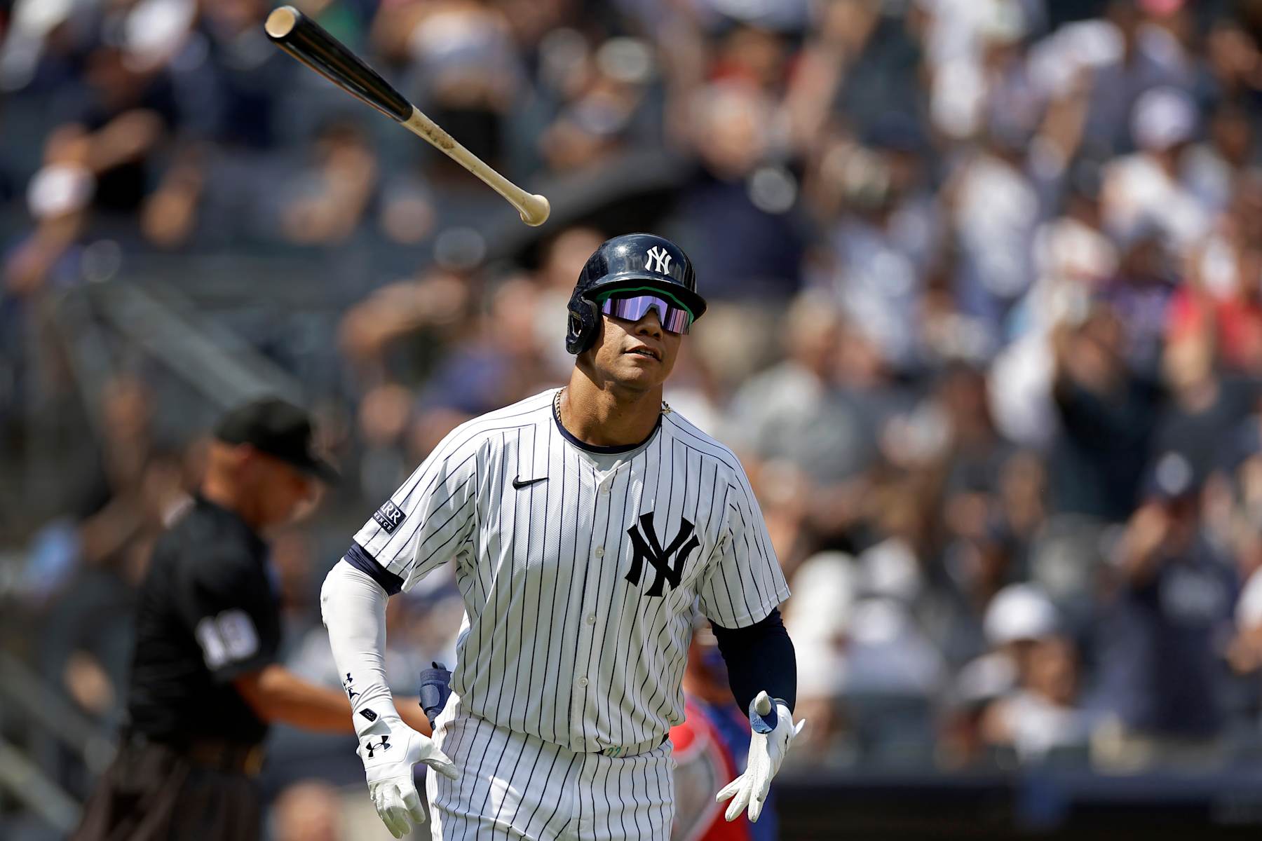 NEW YORK, NY - AUGUST 11: Juan Soto #22 of the New York Yankees throws his bat after hitting a home run during the third inning against the Texas Rangers at Yankee Stadium on August 11, 2024 in New York City. (Photo by Adam Hunger/Getty Images)