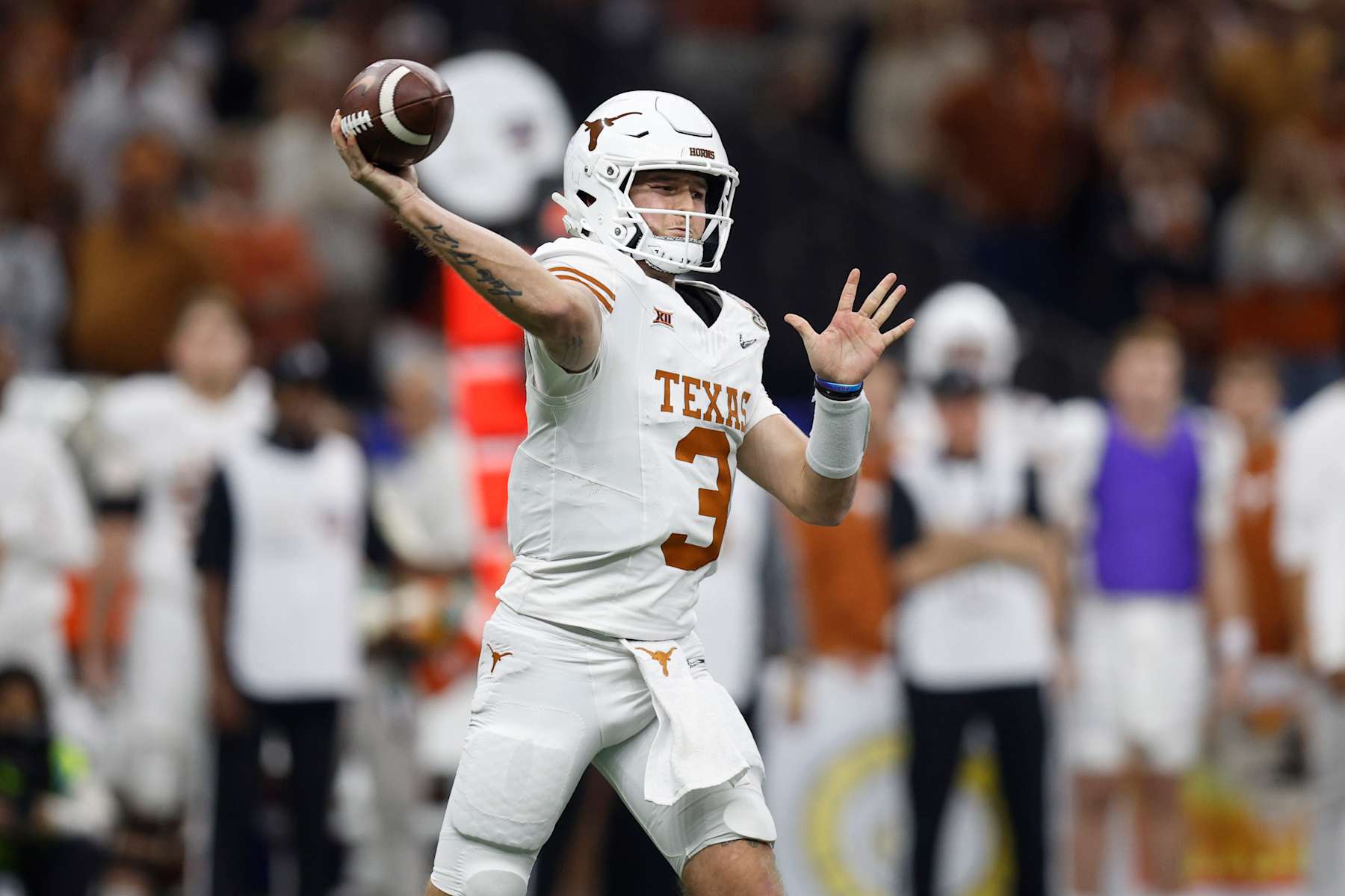NEW ORLEANS, LOUISIANA - JANUARY 01: Quinn Ewers #3 of the Texas Longhorns throws a pass during the second quarter against the Washington Huskies during the CFP Semifinal Allstate Sugar Bowl at Caesars Superdome on January 01, 2024 in New Orleans, Louisiana. (Photo by Sean Gardner/Getty Images)