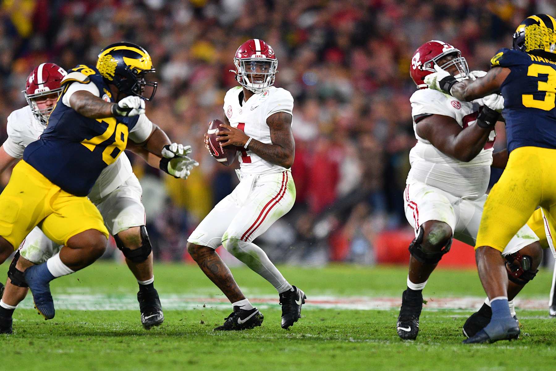PASADENA, CA - JANUARY 01: QB Jalen Milroe (4) of the Alabama Crimson Tide drops back to pass during the Alabama Crimson Tide game versus the Michigan Wolverines CFP Semifinal at the Rose Bowl Game on January, 1, 2024, at the Rose Bowl Stadium in Pasadena, CA. (Photo by Brian Rothmuller/Icon Sportswire via Getty Images)