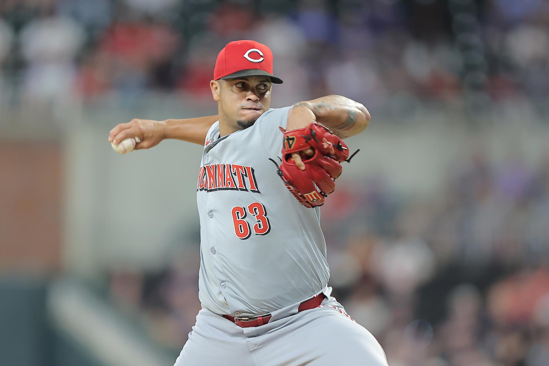 ATLANTA, GA - SEPTEMBER 09: Cincinnati Reds relief pitcher Fernando Cruz (63) delivers during the Monday evening MLB game between the Cincinnati Reds and the Atlanta Braves on September 9, 2024 at Truist Park in Atlanta, Georgia.  (Photo by David J. Griffin/Icon Sportswire via Getty Images)
