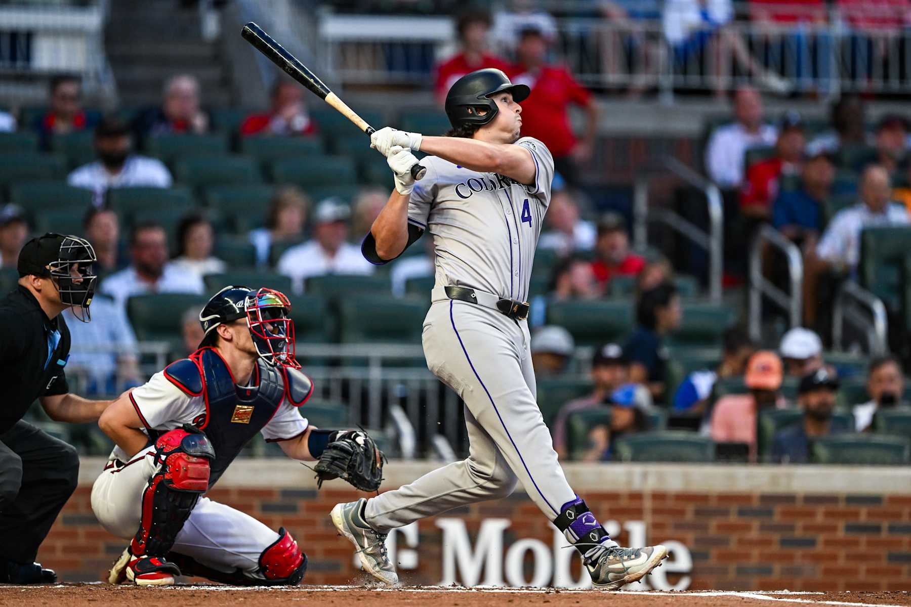 ATLANTA, GA  SEPTEMBER 05:  Colorado first baseman Michael Toglia (4) hits a home run during the MLB game between the Colorado Rockies and the Atlanta Braves on September 5th, 2024 at Truist Park in Atlanta, GA. (Photo by Rich von Biberstein/Icon Sportswire via Getty Images)