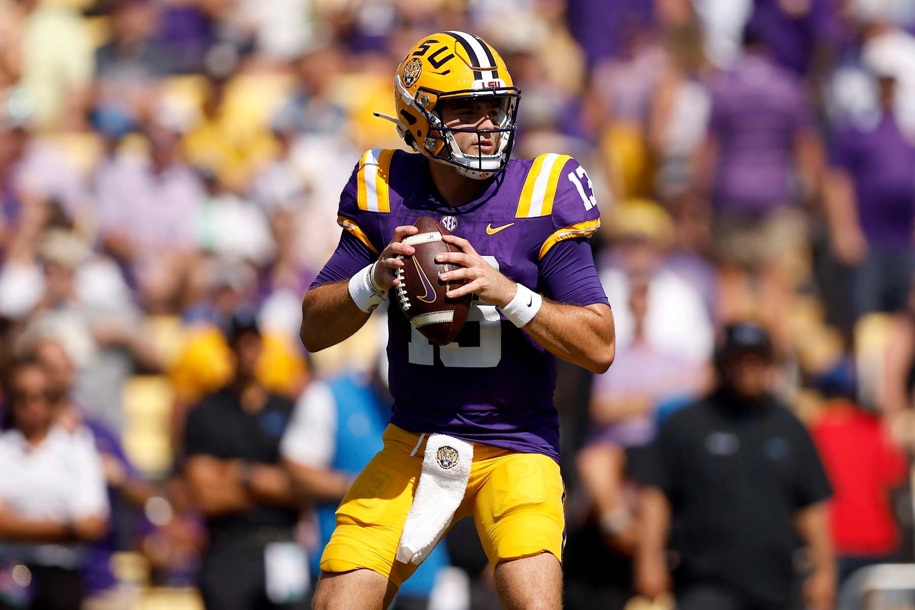 BATON ROUGE, LOUISIANA - SEPTEMBER 21: Garrett Nussmeier #13 of the LSU Tigers looks to pass during the first quarter of an NCAA football game against the UCLA Bruins at Tiger Stadium on September 21, 2024 in Baton Rouge, Louisiana.  (Photo by Sean Gardner/Getty Images)