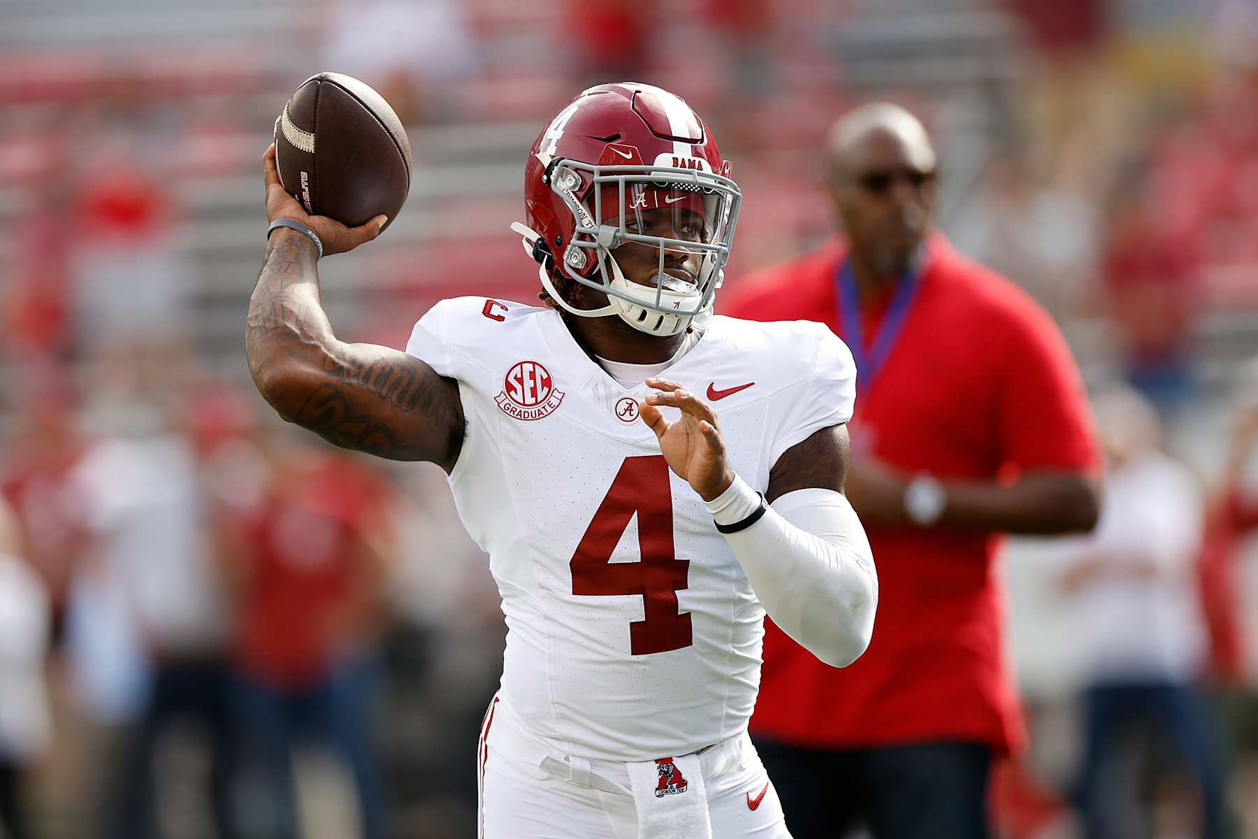 MADISON, WISCONSIN - SEPTEMBER 14: Jalen Milroe #4 of the Alabama Crimson Tide warms up before game against Wisconsin Badgers at Camp Randall Stadium on September 14, 2024 in Madison, Wisconsin. (Photo by John Fisher/Getty Images)