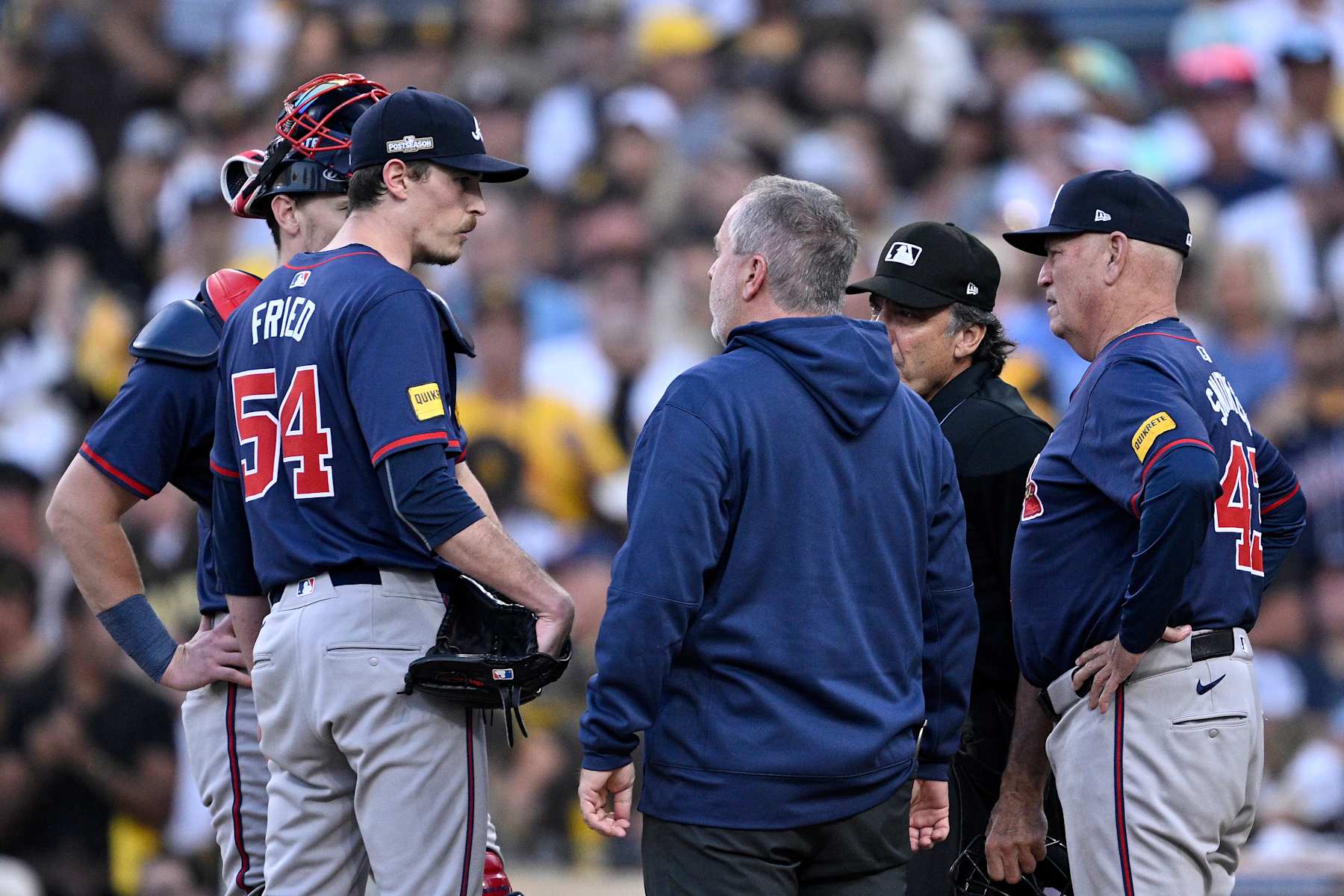 SAN DIEGO, CALIFORNIA - OCTOBER 02: Max Fried #54 of the Atlanta Braves talks with Manager Brian Snitker #43 against the San Diego Padres during the first inning in Game Two of the Wild Card Series at Petco Park on October 02, 2024 in San Diego, California.  (Photo by Orlando Ramirez/Getty Images)