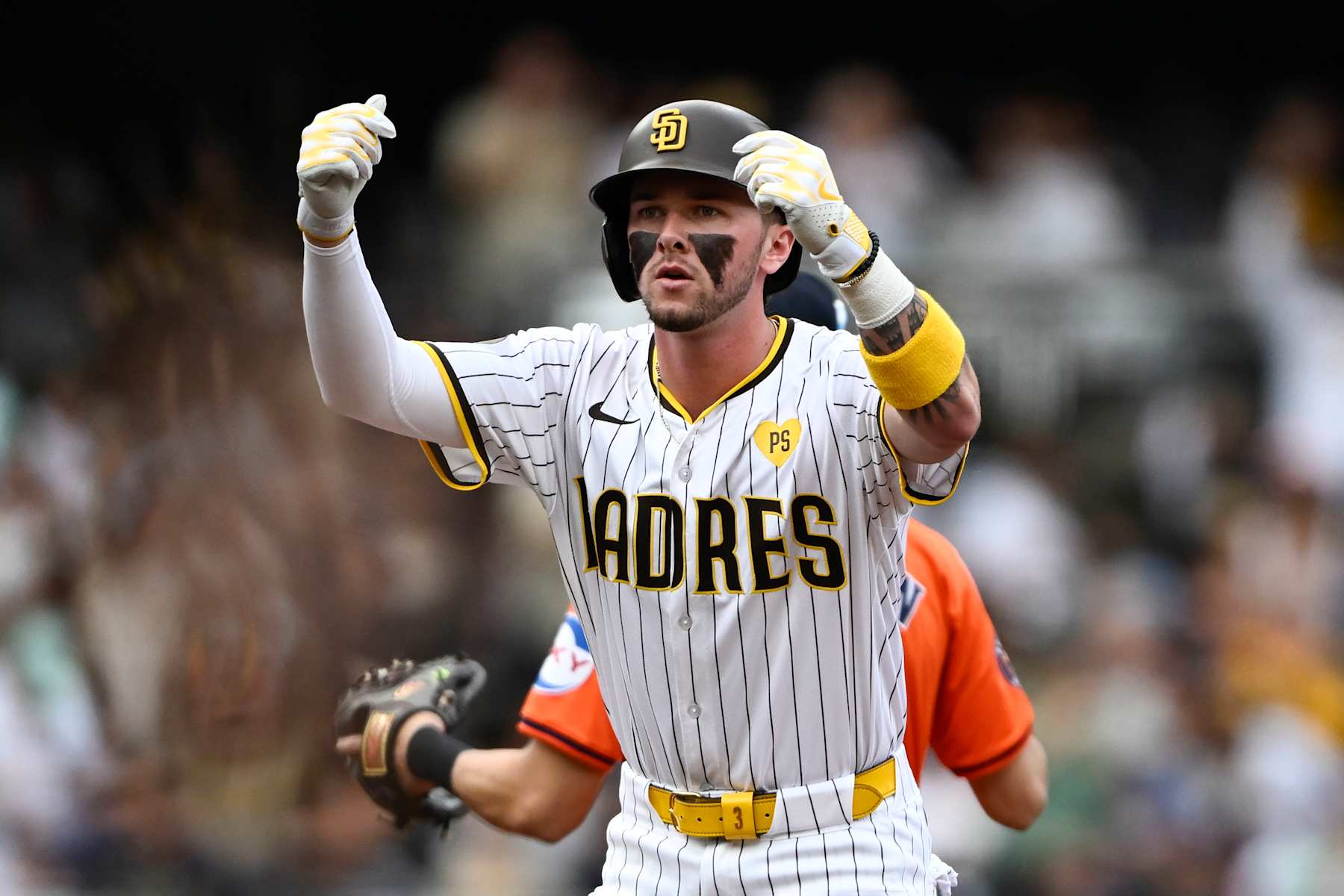 SAN DIEGO, CA - SEPTEMBER 18: Jackson Merrill #3 of the San Diego Padres gestures after hitting a double during the second inning of a baseball game against the Houston Astros on September 18, 2024 at Petco Park in San Diego, California. (Photo by Denis Poroy/Getty Images)