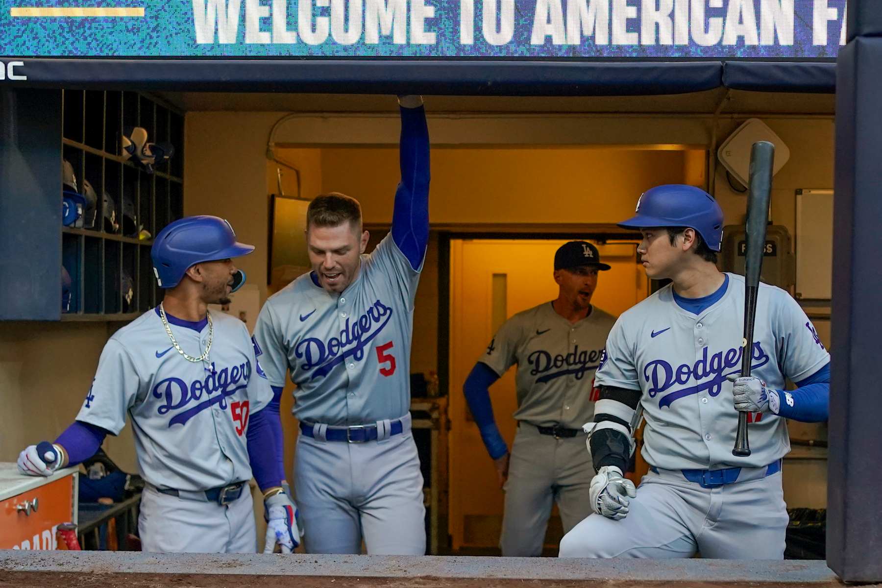 MILWAUKEE, WI - AUGUST 13: Los Angeles Dodgers outfielder Mookie Betts (50), Los Angeles Dodgers infielder Freddie Freeman (5) and Los Angeles Dodgers designated hitter Shohei Ohtani (17) hangout in the dugout before a MLB game between the Milwaukee Brewers and Los Angeles Dodgers on August 13, 2024, at American Family Field in Milwaukee, WI. (Photo by Nick Wosika/Icon Sportswire via Getty Images)