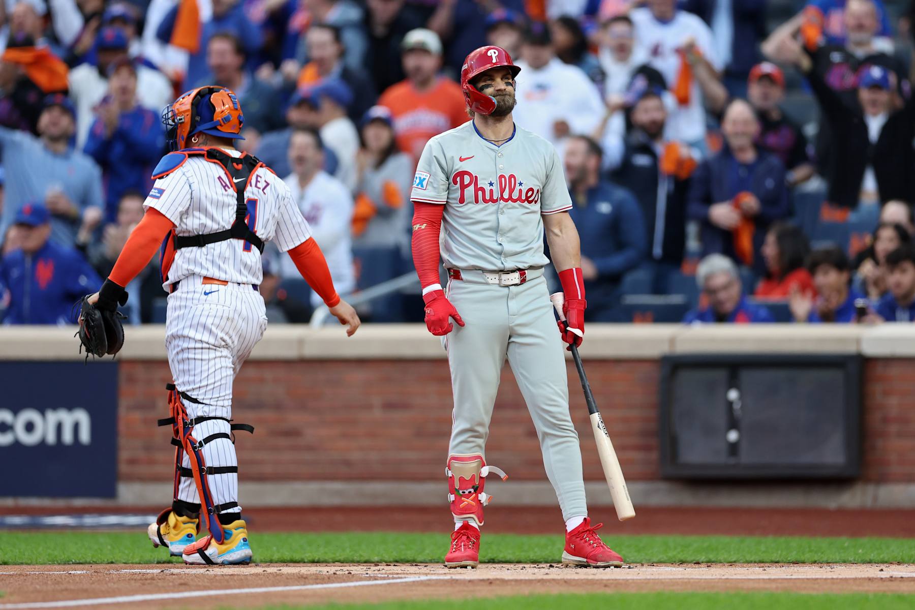 NEW YORK, NEW YORK - OCTOBER 09: Bryce Harper #3 of the Philadelphia Phillies reacts after striking out in the first inning against the New York Mets during Game Four of the Division Series at Citi Field on October 09, 2024 in New York City. (Photo by Elsa/Getty Images)