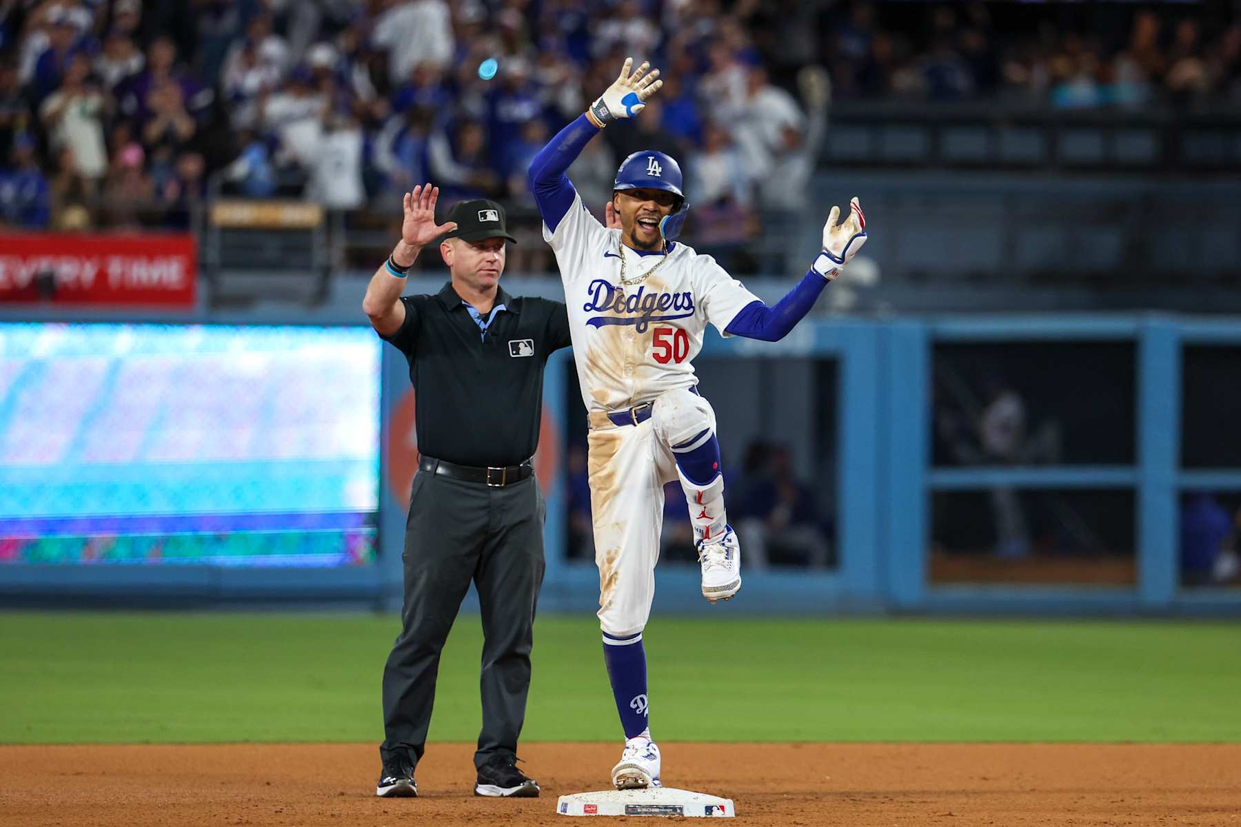 LOS ANGELES, CA - OCTOBER 20: Mookie Betts #50 of the Los Angeles Dodgers celebrates on second base after hitting an RBI double in the eighth inning during Game 6 of the NLCS presented by loanDepot between the New York Mets and the Los Angeles Dodgers at Dodger Stadium on Sunday, October 20, 2024 in Los Angeles, California. (Photo by Rob Leiter/MLB Photos via Getty Images)