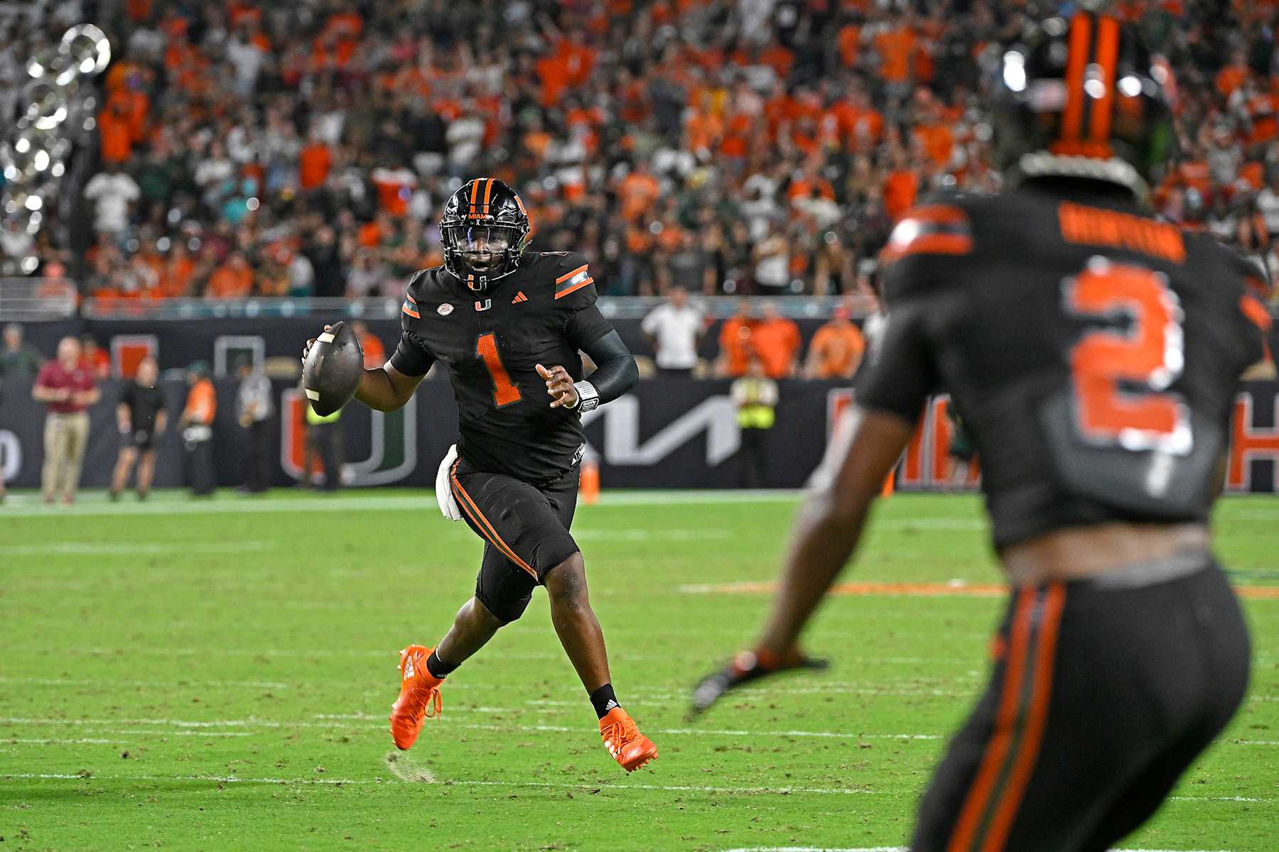 MIAMI GARDENS, FL - OCTOBER 26:  Miami quarterback Cam Ward (1) looks for a receiver downfield in the second quarter as the Miami Hurricanes faced the Florida State Seminoles on October 26, 2024, at Hard Rock Stadium in Miami Gardens, Florida. (Photo by Samuel Lewis/Icon Sportswire via Getty Images)