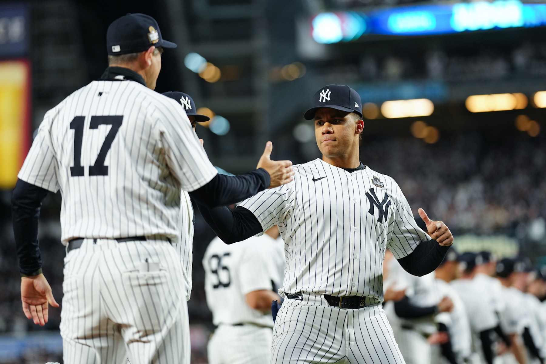 NEW YORK, NY - OCTOBER 28:   Juan Soto #22 of the New York Yankees greets manager Aaron Boone #17 on the field prior to Game 3 of the 2024 World Series presented by Capital One between the Los Angeles Dodgers and the New York Yankees at Yankee Stadium on Monday, October 28, 2024 in New York, New York. (Photo by Daniel Shirey/MLB Photos via Getty Images)