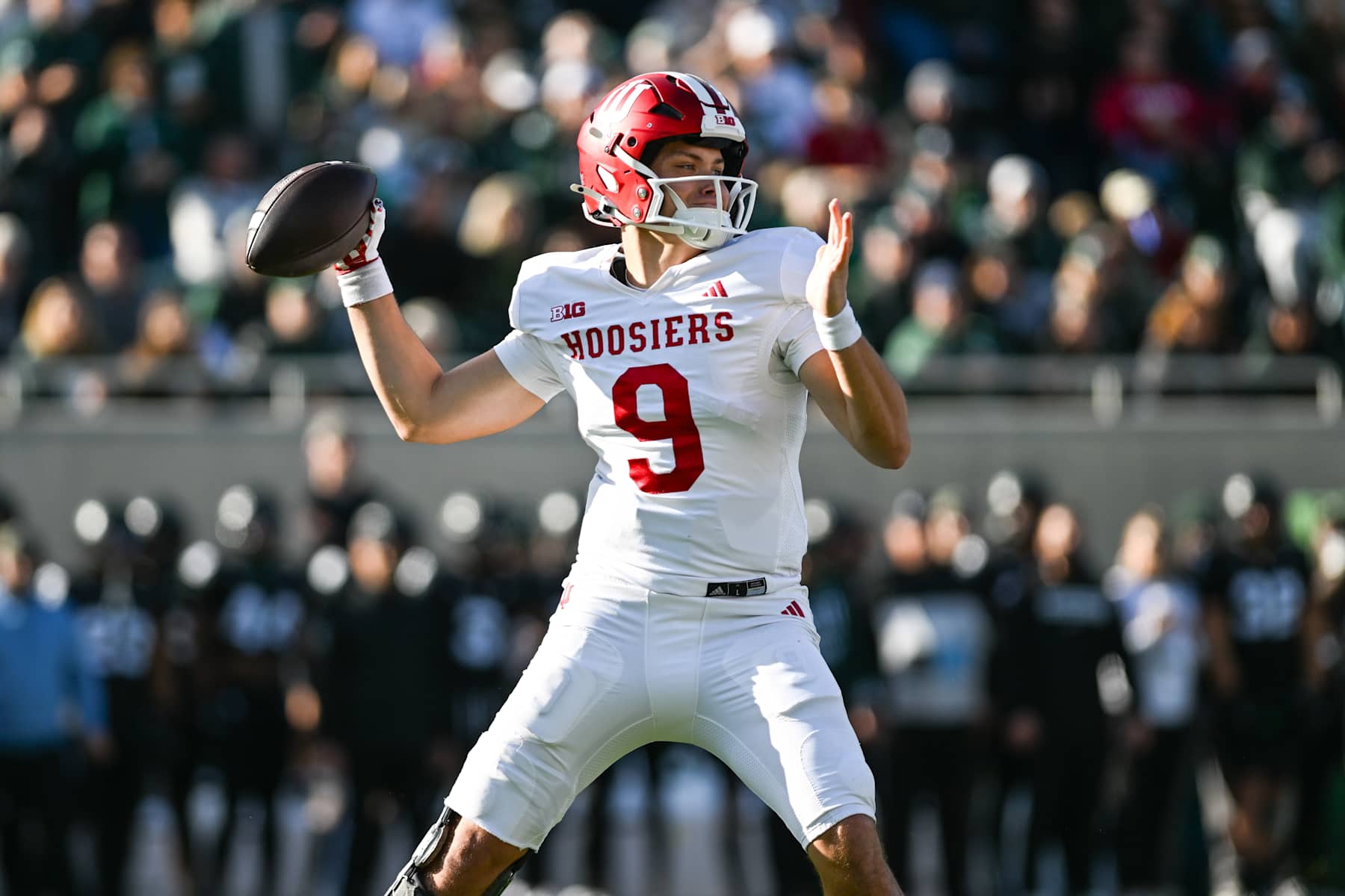 EAST LANSING, MI - NOVEMBER 02: Indiana Hoosiers quarterback Kurtis Rourke (9) stands in the pocket to pass the ball during a college football game between the Michigan State Spartans and the Indiana Hoosiers on November 2, 2024, at Spartan Stadium in East Lansing, MI. (Photo by Adam Ruff/Icon Sportswire via Getty Images)