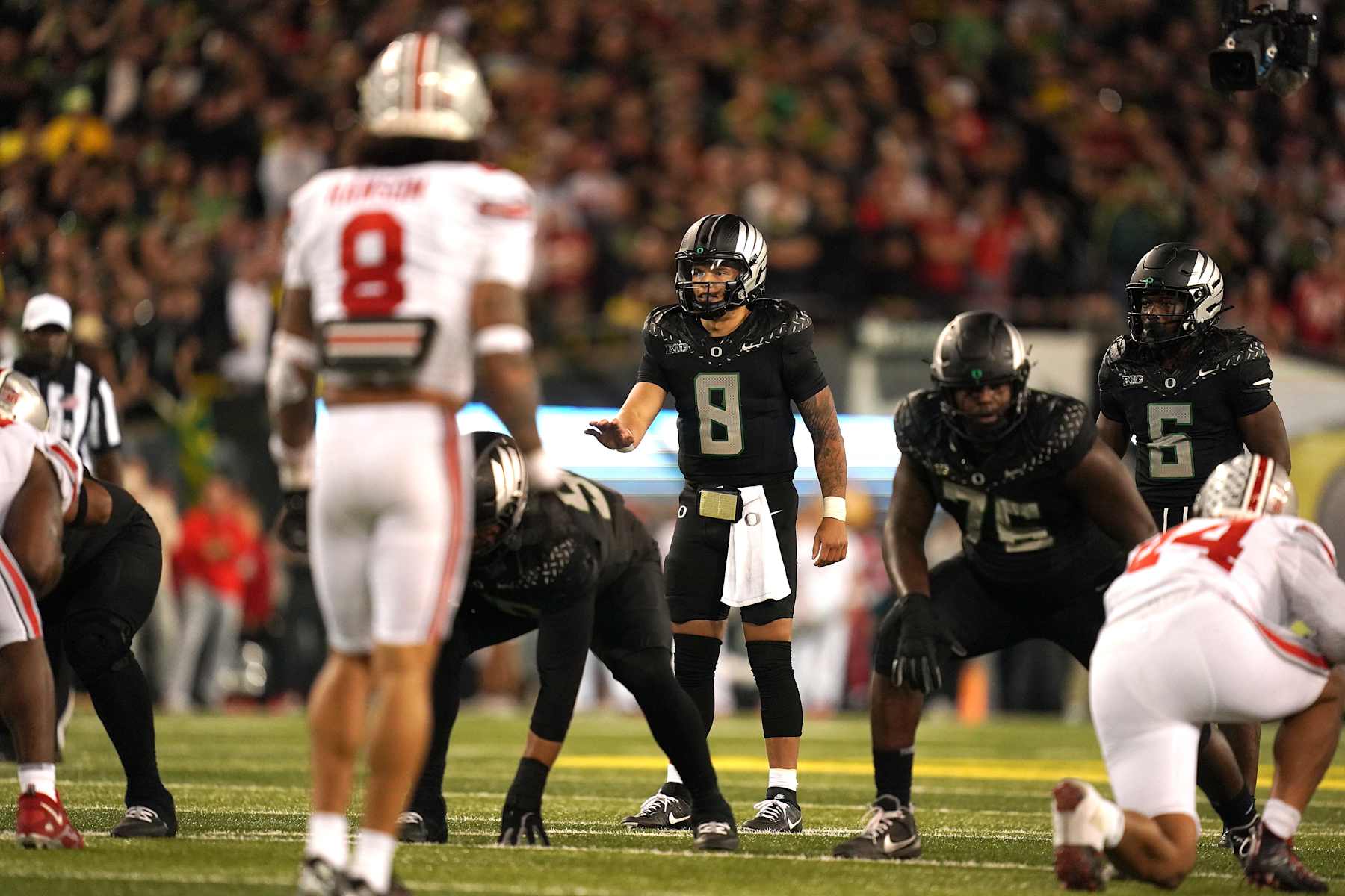 EUGENE, OREGON - OCTOBER 12: Dillon Gabriel #8 of the Oregon Ducks calls a play at the line during the fourth quarter against the Ohio State Buckeyes at Autzen Stadium on October 12, 2024 in Eugene, Oregon. (Photo by Ali Gradischer/Getty Images)