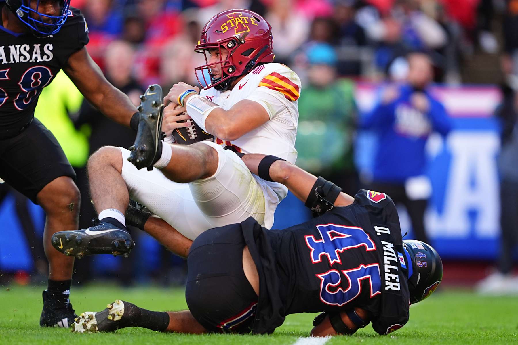KANSAS CITY, MISSOURI - NOVEMBER 9: Defensive end Dean Miller #45 of the Kansas Jayhawks sacks quarterback Rocco Becht #3 of the Iowa State Cyclones during the first quarter at Arrowhead Stadium on November 9, 2024 in Kansas City, Missouri.  (Photo by Kyle Rivas/Getty Images)