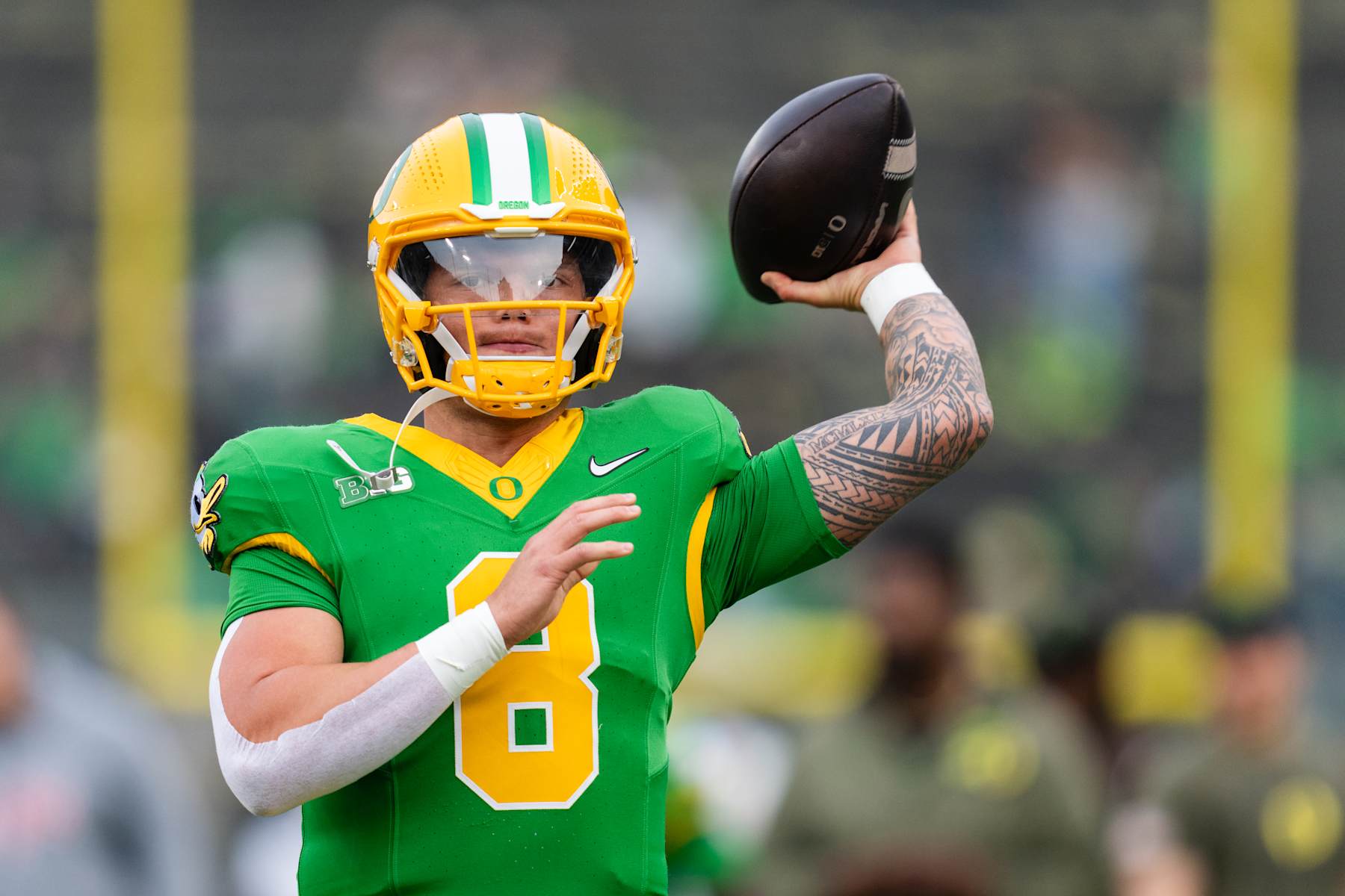 EUGENE, OREGON - NOVEMBER 9: Quarterback Dillon Gabriel #8 of the Oregon Ducks warms up before the game against the Maryland Terrapins at Autzen Stadium on November 9, 2024 in Eugene, Oregon.  (Photo by Ali Gradischer/Getty Images)
