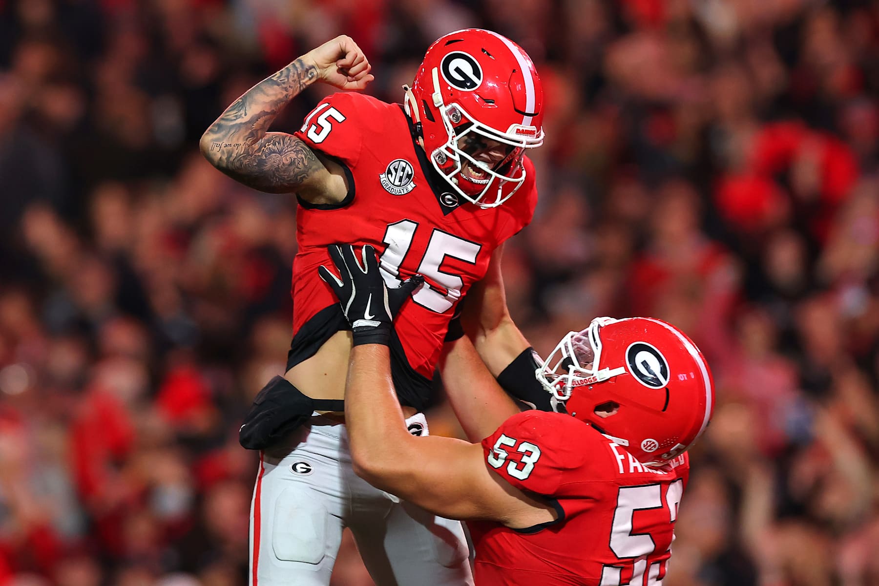ATHENS, GEORGIA - NOVEMBER 16: Carson Beck #15 and Dylan Fairchild #53 of the Georgia Bulldogs celebrate after a touchdown during the second quarter against the Tennessee Volunteers at Sanford Stadium on November 16, 2024 in Athens, Georgia. (Photo by Kevin C. Cox/Getty Images)