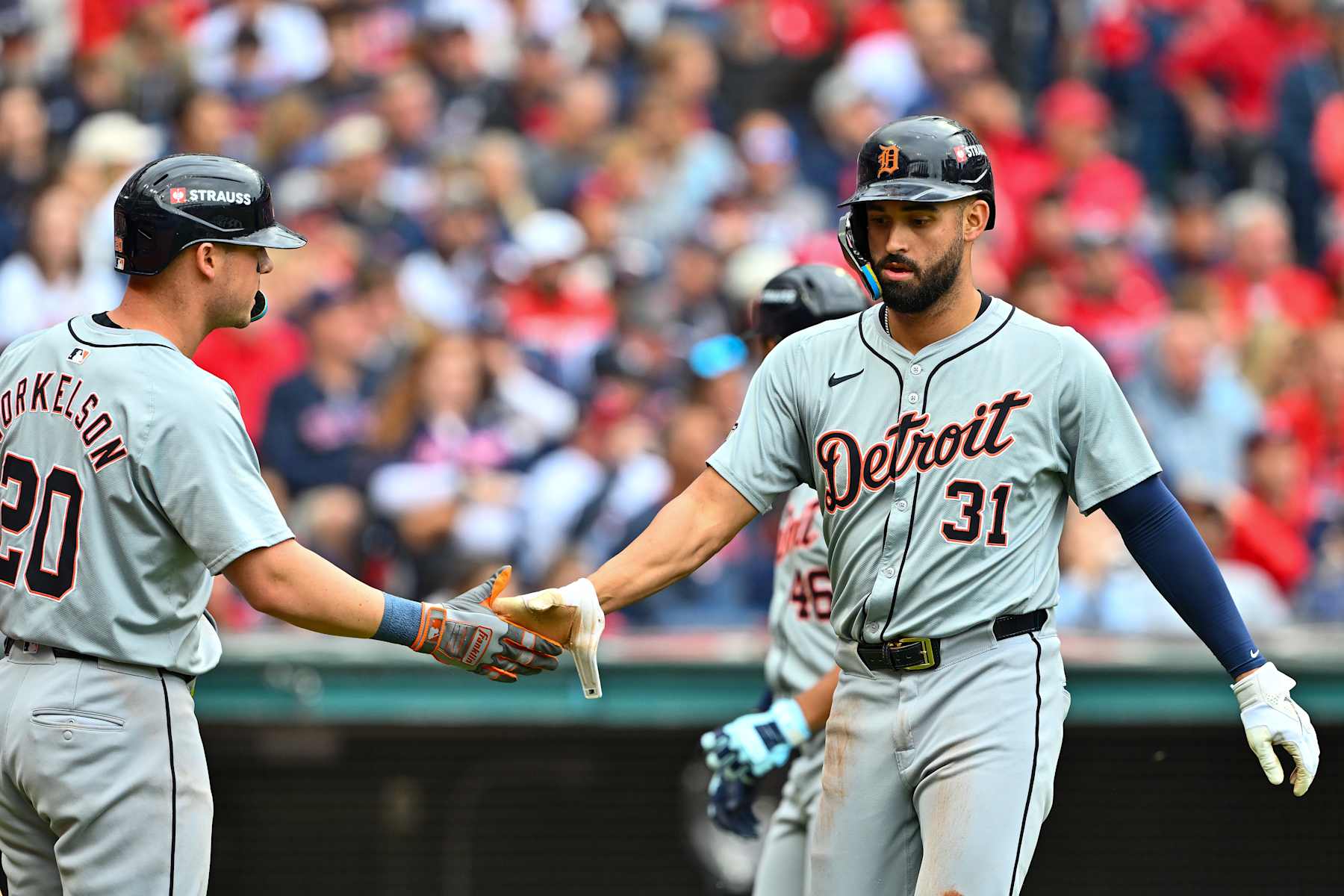 CLEVELAND, OHIO - OCTOBER 12: Riley Greene #31 of the Detroit Tigers celebrates a run with teammate Spencer Torkelson  #20 during the seventh inning against the Cleveland Guardians during Game Five of the Division Series at Progressive Field on October 12, 2024 in Cleveland, Ohio. (Photo by Jason Miller/Getty Images)