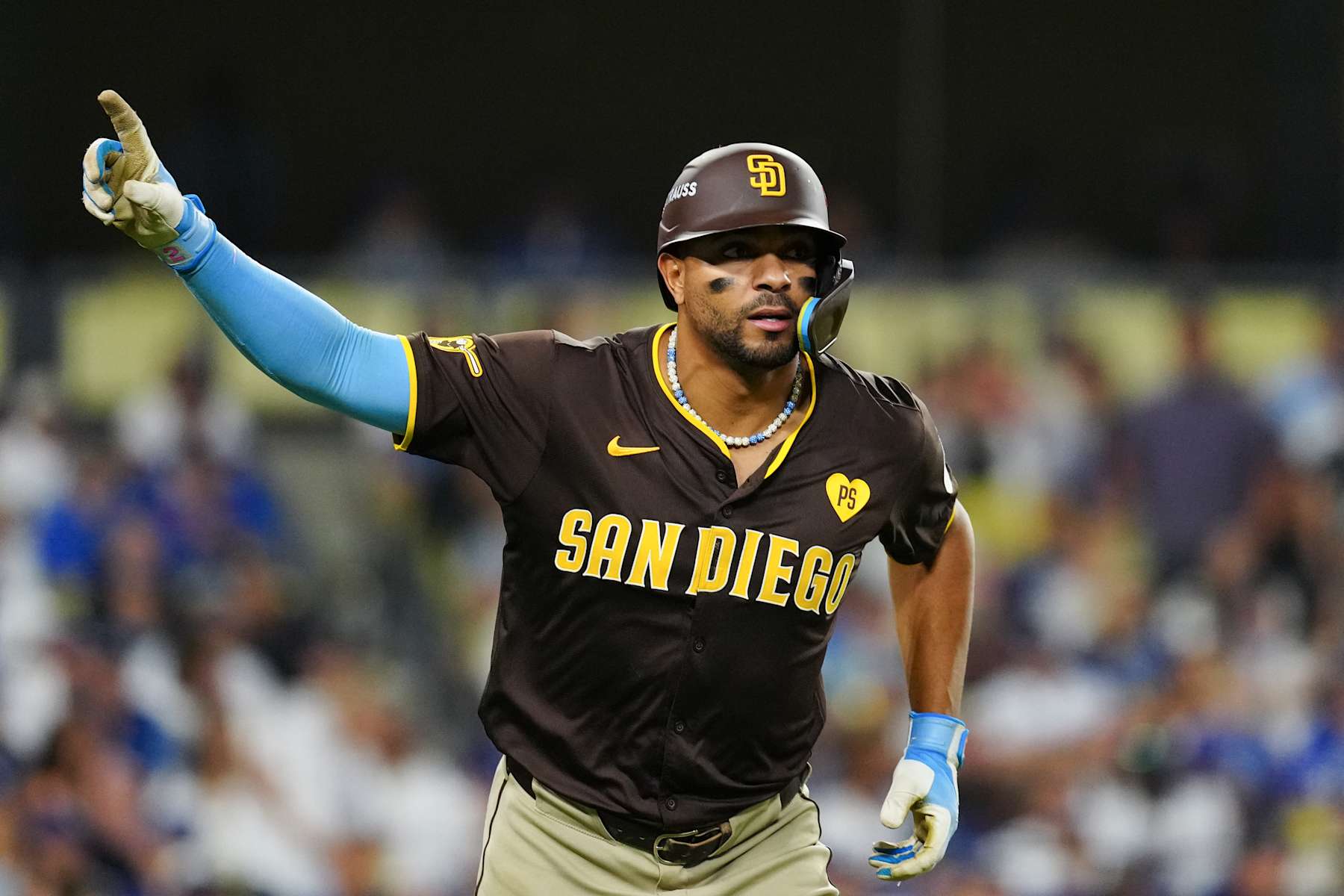 LOS ANGELES, CA - OCTOBER 06: Xander Bogaerts #2 of the San Diego Padres celebrates after hitting a solo home run in the eighth inning during Game 2 of the Division Series presented by Booking.com between the San Diego Padres and the Los Angeles Dodgers at Dodger Stadium on Sunday, October 6, 2024 in Los Angeles, California. (Photo by Daniel Shirey/MLB Photos via Getty Images)