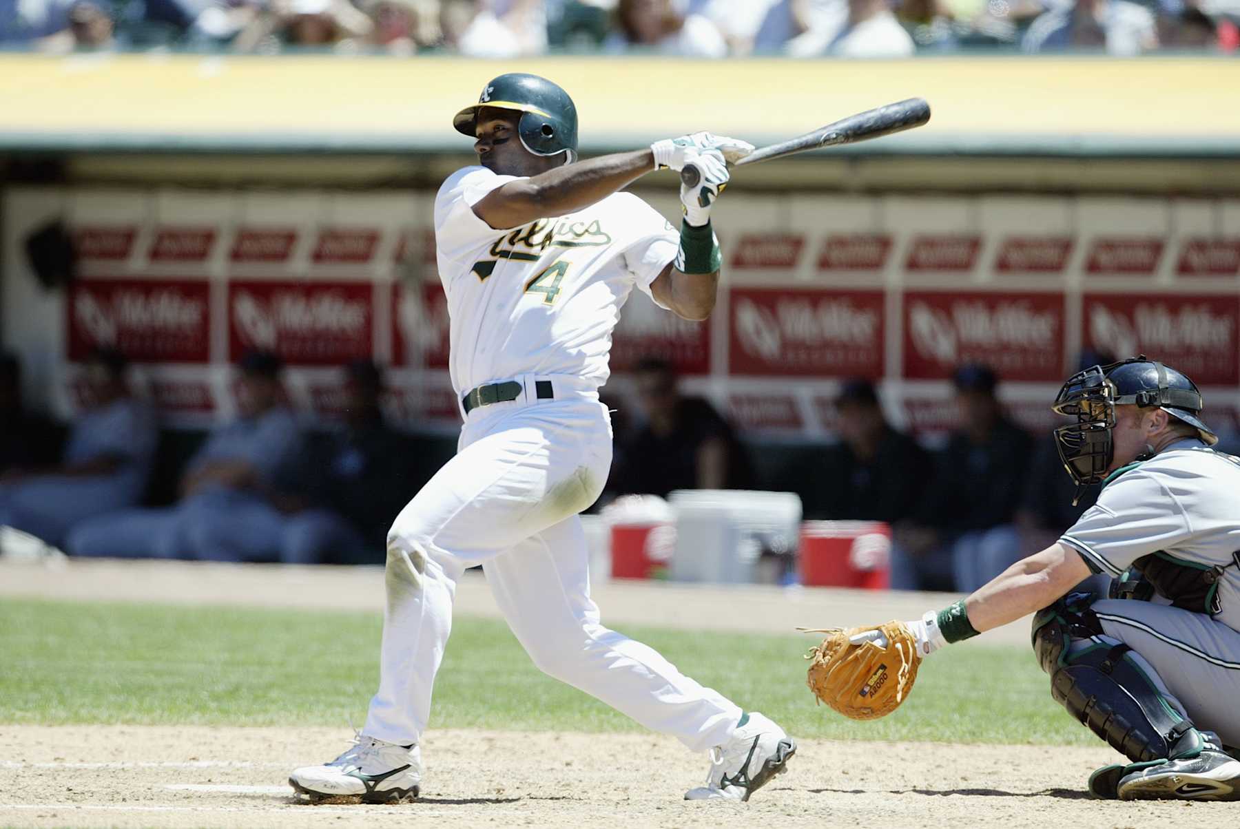 OAKLAND, CA - JULY 10:  Shortstop Miguel Tejada #4 of the Oakland Athletics swings at a Tampa Bay Devil Rays pitch during the MLB game at the Network Associates Coliseum on July 10, 2003 in Oakland, California.  The Athletics won 5-2.  (Photo by Jed Jacobsohn/Getty Images)    