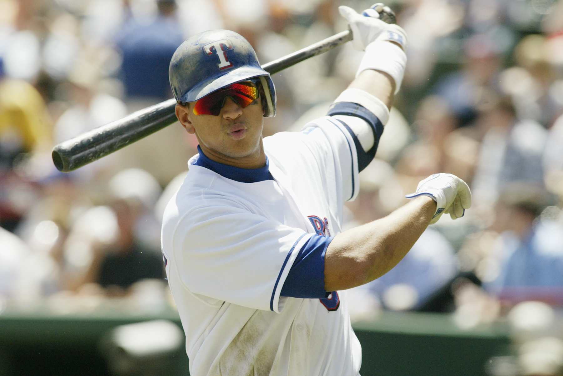 ARLINGTON, TX - APRIL 24:  Shortstop Alex Rodriguez #3 of the Texas Rangers takes practice swings during the game against the Boston Red Sox at the Ballpark in Arlington on April 24, 2003 in Arlington, Texas.  The Rangers defeated the Red Sox 16-5.  (Photo by Ronald Martinez/Getty Images)