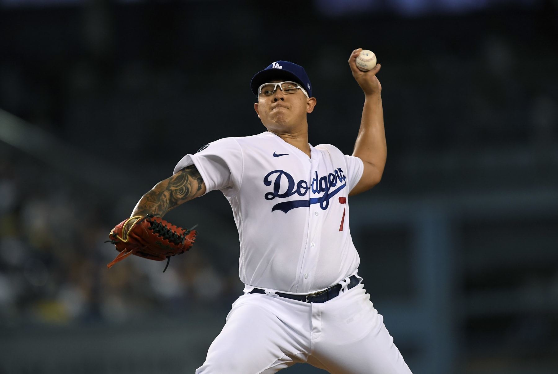 LOS ANGELES, CA - AUGUST 30: Starting pitcher Julio Urias #7 of the Los Angeles Dodgers throws against the Atlanta Braves during the second inning at Dodger Stadium on August 30, 2021 in Los Angeles, California. (Photo by Kevork Djansezian/Getty Images)