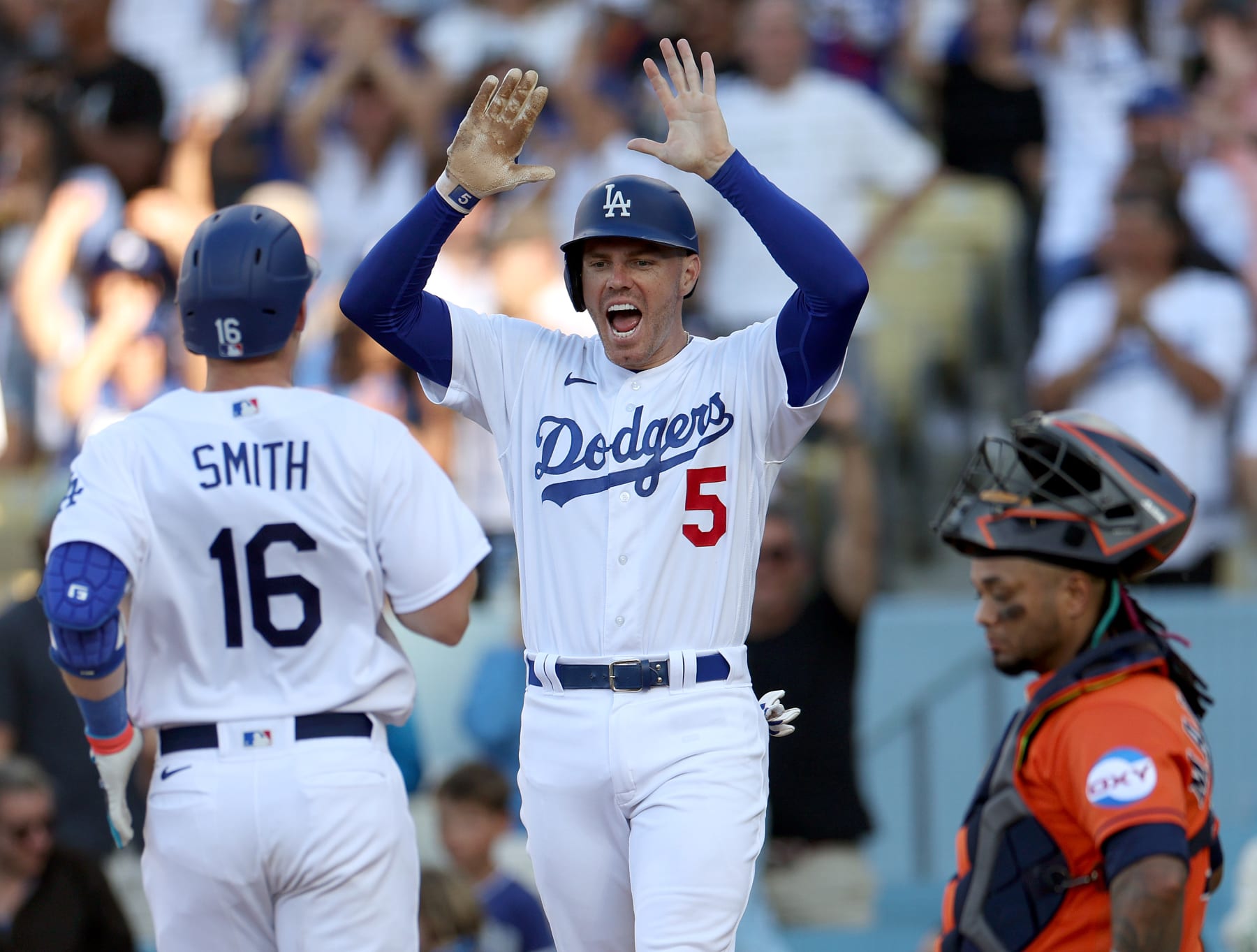 LOS ANGELES, CALIFORNIA - JUNE 25: Freddie Freeman #5 of the Los Angeles Dodgers celebrates a two run homerun from Will Smith #16, to tie the game 4-4 in front of Martin Maldonado #15 of the Houston Astros during the eighth inning at Dodger Stadium on June 25, 2023 in Los Angeles, California. (Photo by Harry How/Getty Images)