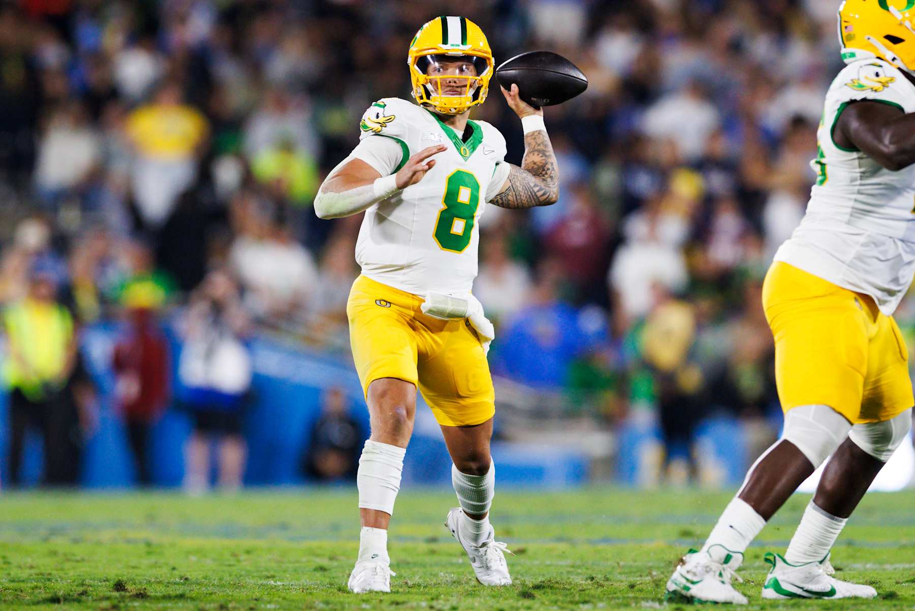 PASADENA, CALIFORNIA - SEPTEMBER 28: Dillon Gabriel #8 of the Oregon Ducks throws during the first half against UCLA Bruins at Rose Bowl on September 28, 2024 in Pasadena, California. (Photo by Ric Tapia/Getty Images)