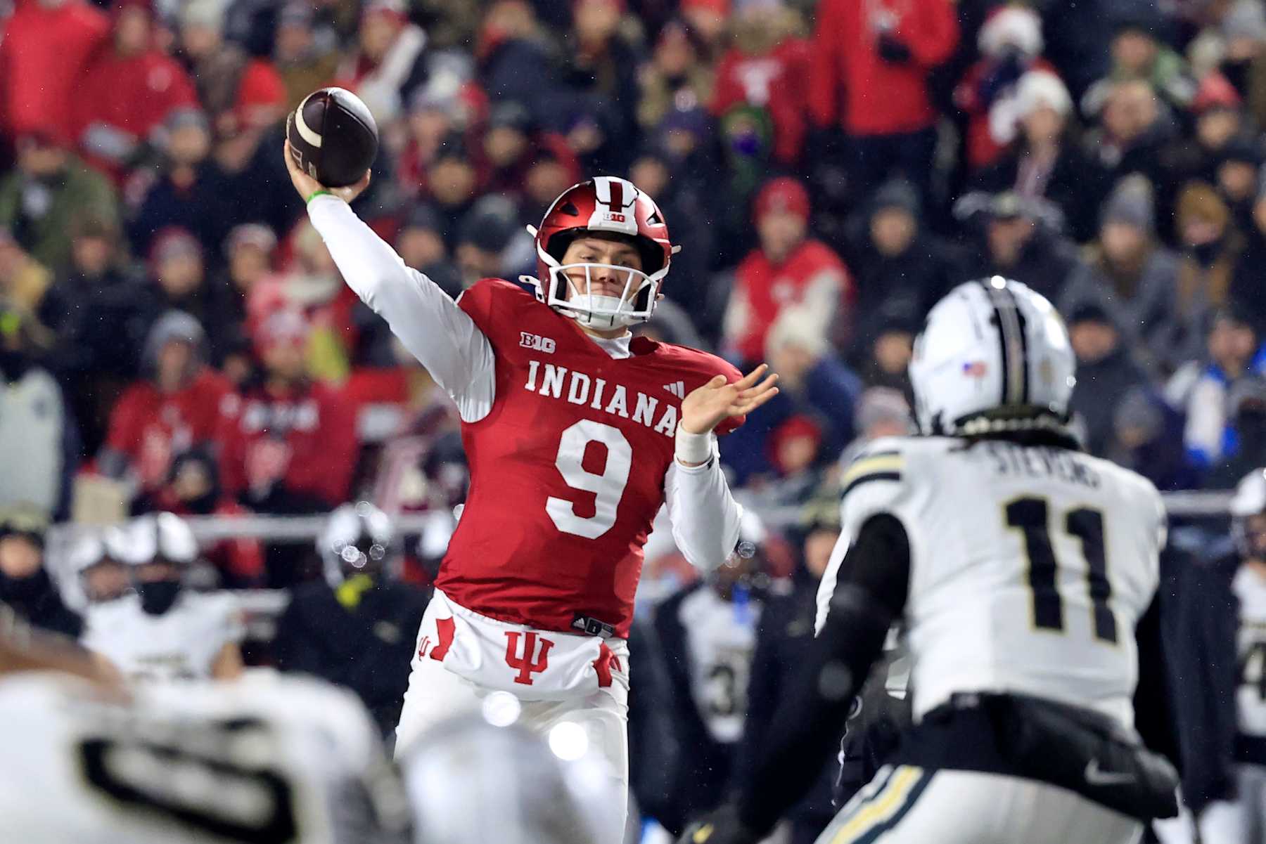 BLOOMINGTON, INDIANA - NOVEMBER 30: Kurtis Rourke #9 of the Indiana Hoosiers throws a touchdown pass during the second quarter against the Purdue Boilermakers at Memorial Stadium on November 30, 2024 in Bloomington, Indiana. (Photo by Justin Casterline/Getty Images)