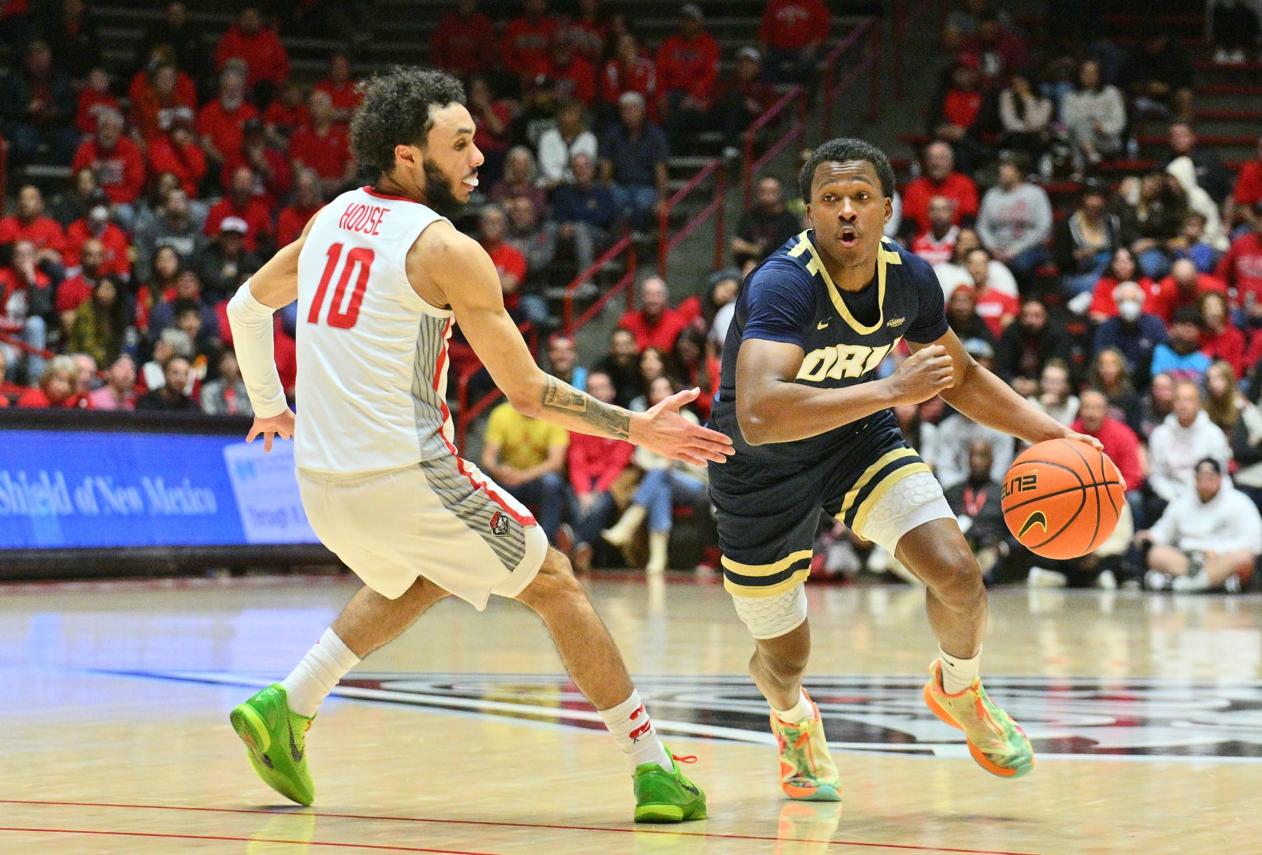 ALBUQUERQUE, NEW MEXICO - JANUARY 09: Max Abmas #3 of the Oral Roberts Golden Eagles dribbles against Jaelen House #10 of the New Mexico Lobos during the first half of their game at The Pit on January 09, 2023 in Albuquerque, New Mexico. (Photo by Sam Wasson/Getty Images)